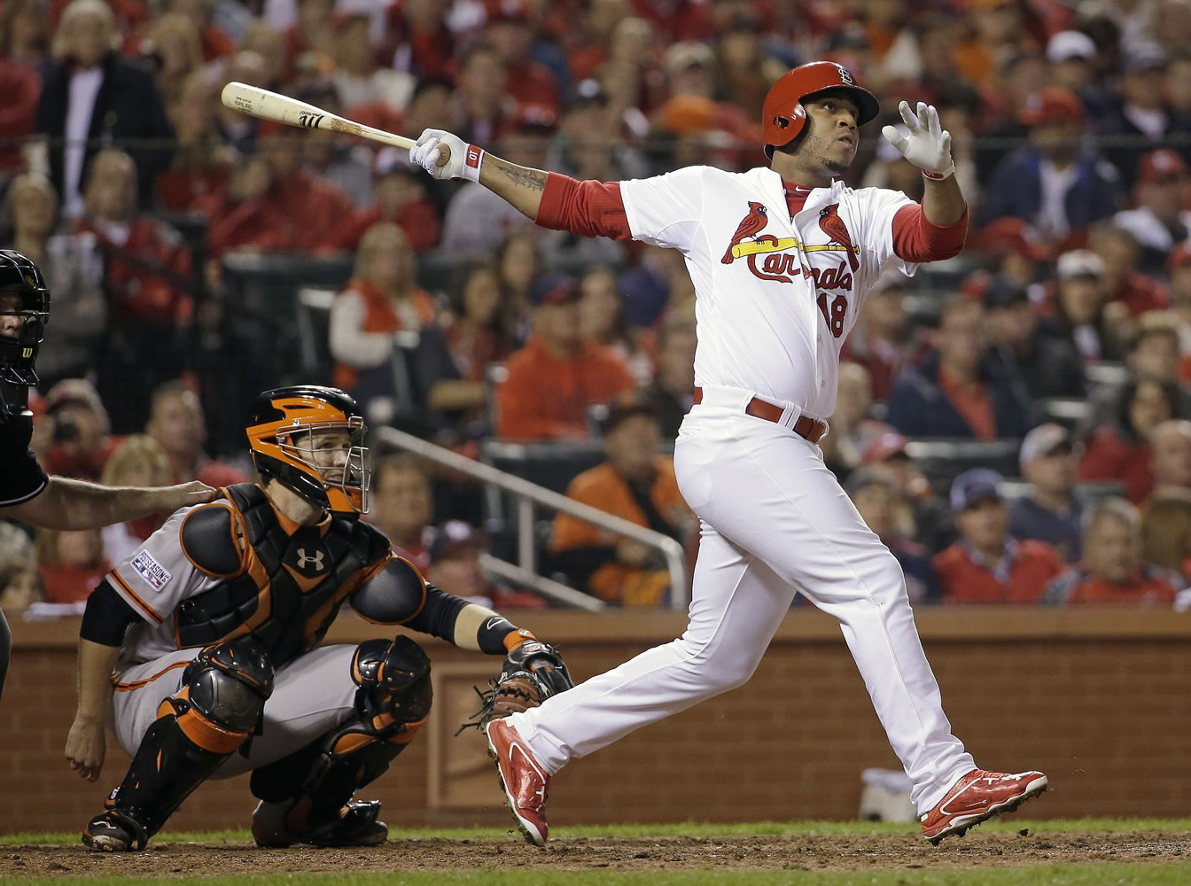 St. Louis Cardinals' Oscar Taveras hitting a home run during the seventh inning of Game 2 of the National League baseball championship series against the San Francisco Giants on Oct. 12, 2014. Authorities say, Sunday, Oct. 26, 2014, Taveras died in a car accident in the Dominican Republic. (AP Photo/David J.