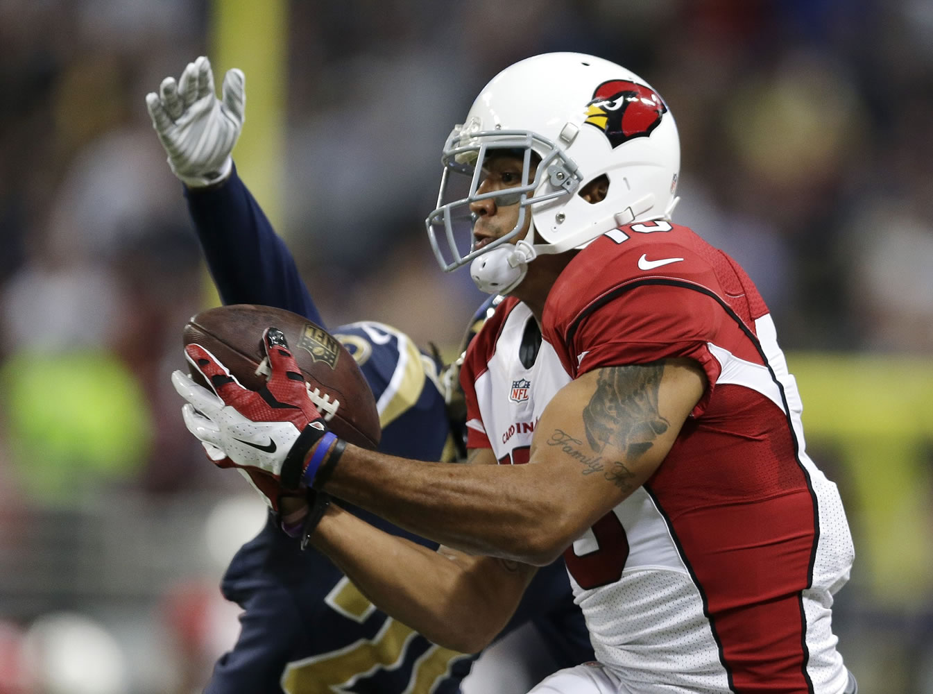 Arizona Cardinals wide receiver Michael Floyd (15) makes a catch against St. Louis Rams' Janoris Jenkins (21) during the first half Thursday, Dec. 11, 2014 in St. Louis.