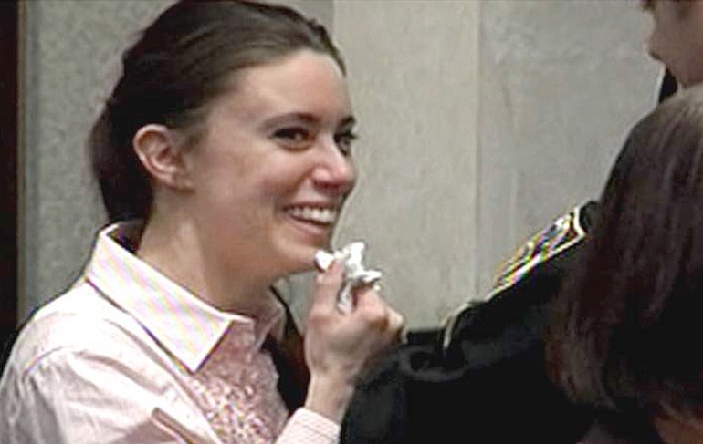 In this image made from video, Casey Anthony smiles as she returns to the defense table after being acquitted of murder charges at the Orange County Courthouse in Orlando, Fla., on Tuesday.