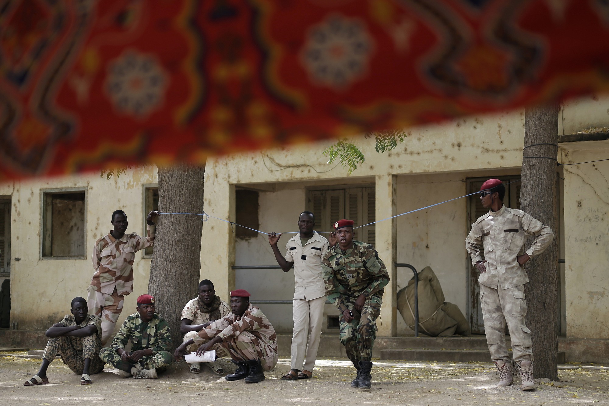 Chadian troops watch others participate in the closing ceremony of operation Flintlock in an army base in N'djamena, Chad, on Monday.
