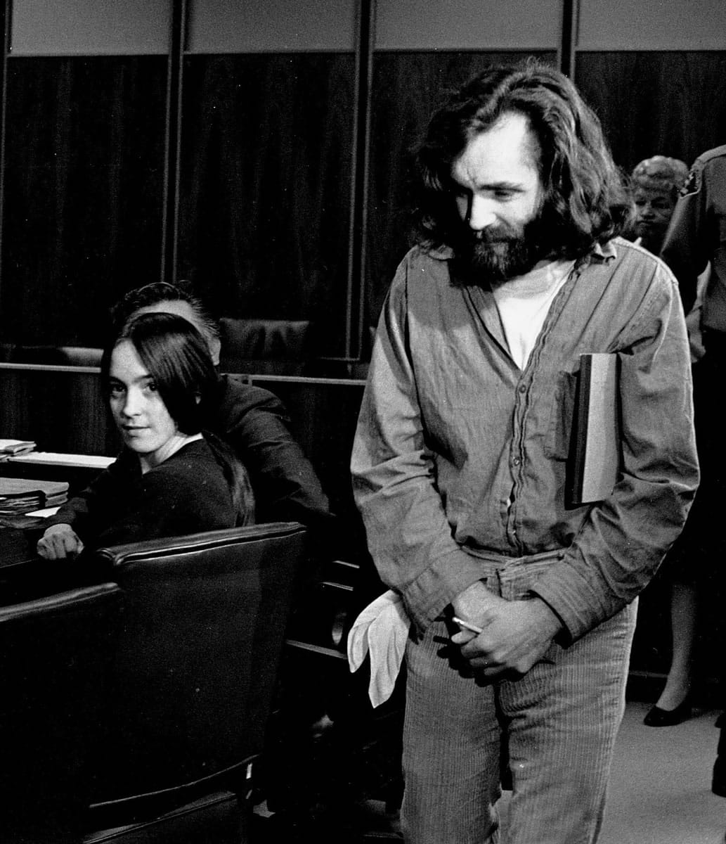 Cult leader Charles Manson walks into the courtroom as Susan Atkins, a member of his family of followers, looks on in Santa Monica, Calif., on Oct. 13,1970. A marriage license has been issued for Manson to wed 26-year-old Afton Elaine Burton, who left her Midwestern home nine years ago and moved to Corcoran, Calif., to be near him. Burton, who goes by the name Star, said that she and Manson will be married next month.