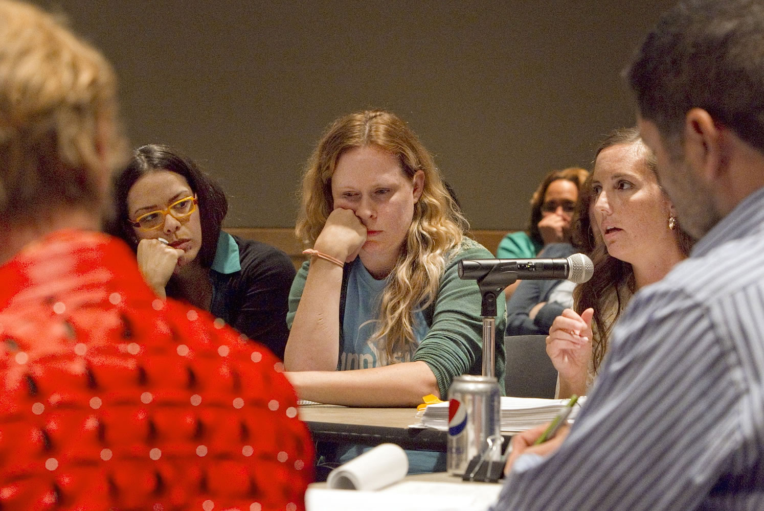Sunnyside Charter School proponents Veronica Rivero Testamarck, left, Erin Martin, center, and Brittany Weaver, right, face the Washington State Charter School Commission  and answer questions at a commission meeting in Yakima on Thursday.