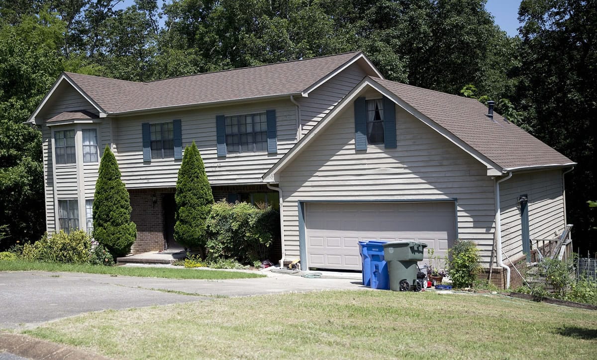 The home where suspected gunman Muhammad Youssef Abdulazeez lived with his parents and sisters is shown Friday, July 17, 2015, in Hixson, Tenn. Counterterrorism investigators are trying to figure out why the 24-year-old Kuwait-born man, who by accounts lived a typical life in suburban America, attacked two military facilities in a shooting rampage that killed four Marines.