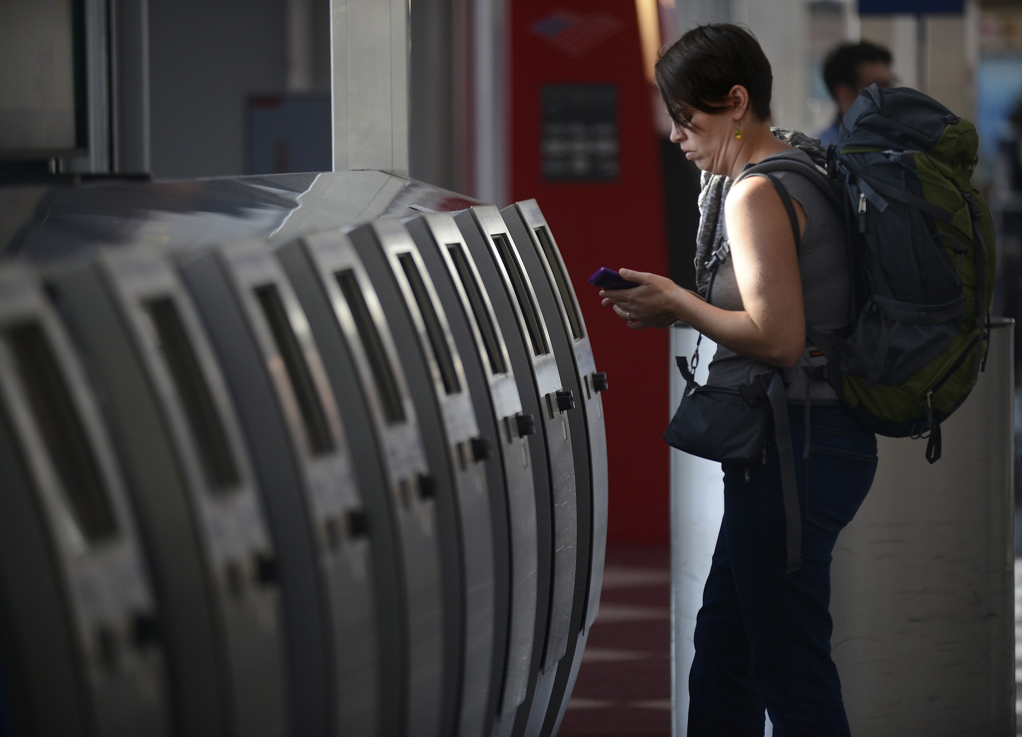 Breanne Eging checks on her flight to Greenville, S.C.,at O'Hare International Airport in Chicago on Friday.