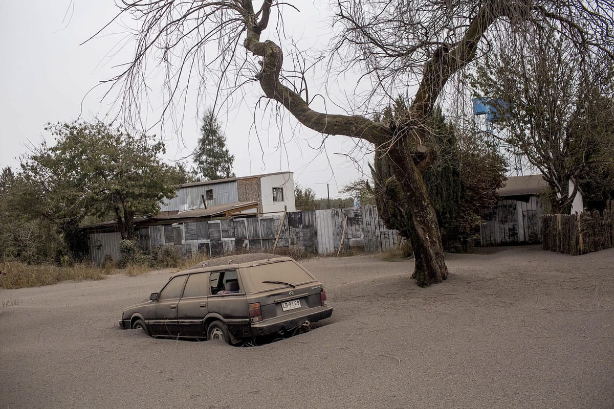 A car is covered in ash Thursday after the Calbuco volcano erupted in Ensenada, Chile.