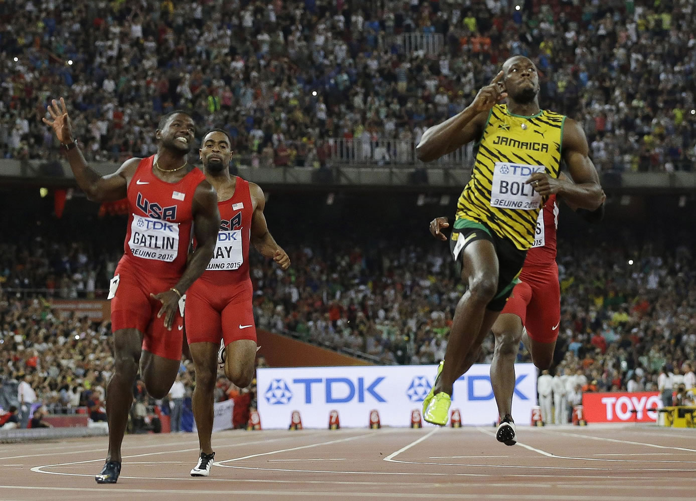 Jamaica's Usain Bolt celebrates after winning the men's 100-meter final at the World Athletics Championships at the Bird's Nest stadium in Beijing, on Sunday, Aug. 23, 2015. (AP Photo/David J.