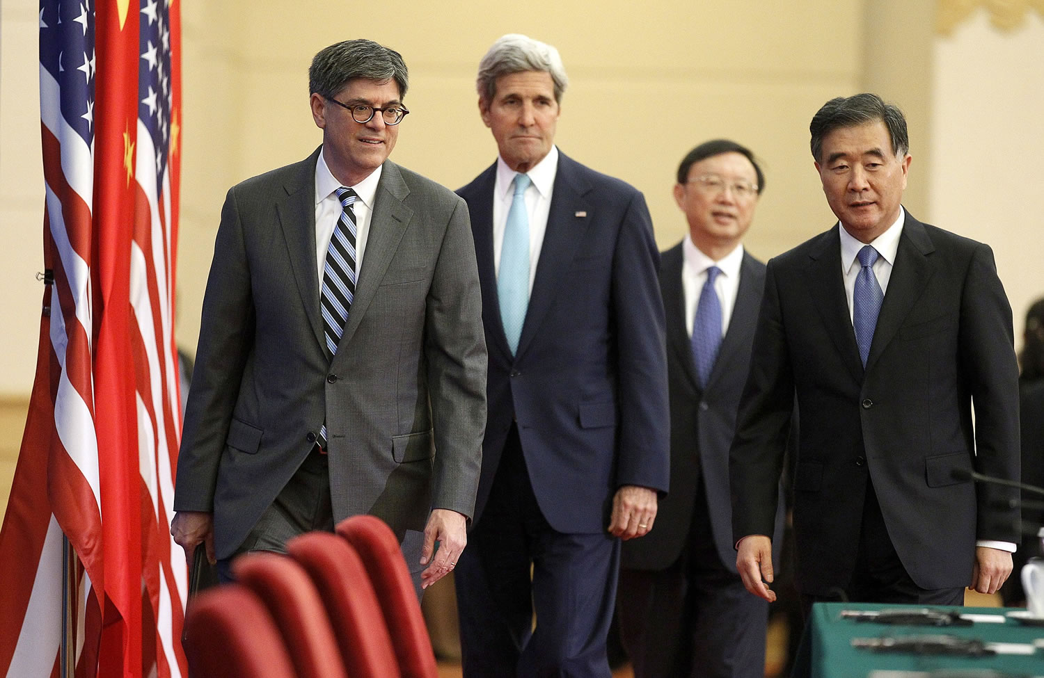 Left to right: U.S. Treasury Secretary Jack Lew, Secretary of State John Kerry, Chinau2019s State Councilor Yang Jiechi and Vice Premier Wang Yang arrive to deliver joint statements at the Great Hall of the People in Beijing on Thursday.