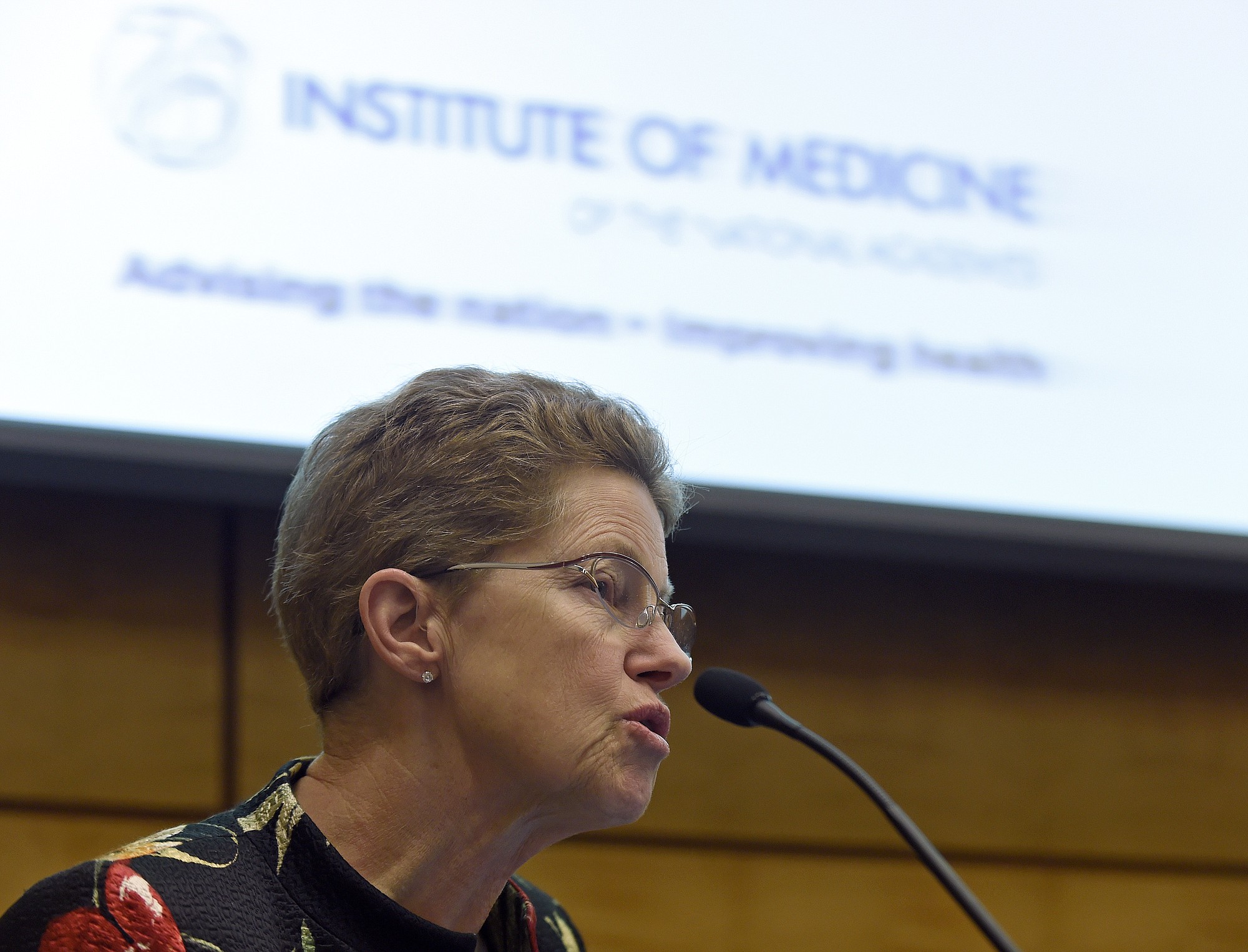 Dr. Ellen Wright Clayton, chair of the Committee on Diagnostic Criteria for Myalgic Encephalomyelitis/Chronic Fatigue Syndrome speaks during an open meeting at the Institute of Medicine in Washington, Tuesday, Feb. 10, 2015. Chronic fatigue syndrome is a real and serious disease that needs a new name to reflect that _ and a straightforward way to diagnose the illness, a government advisory group declares.
