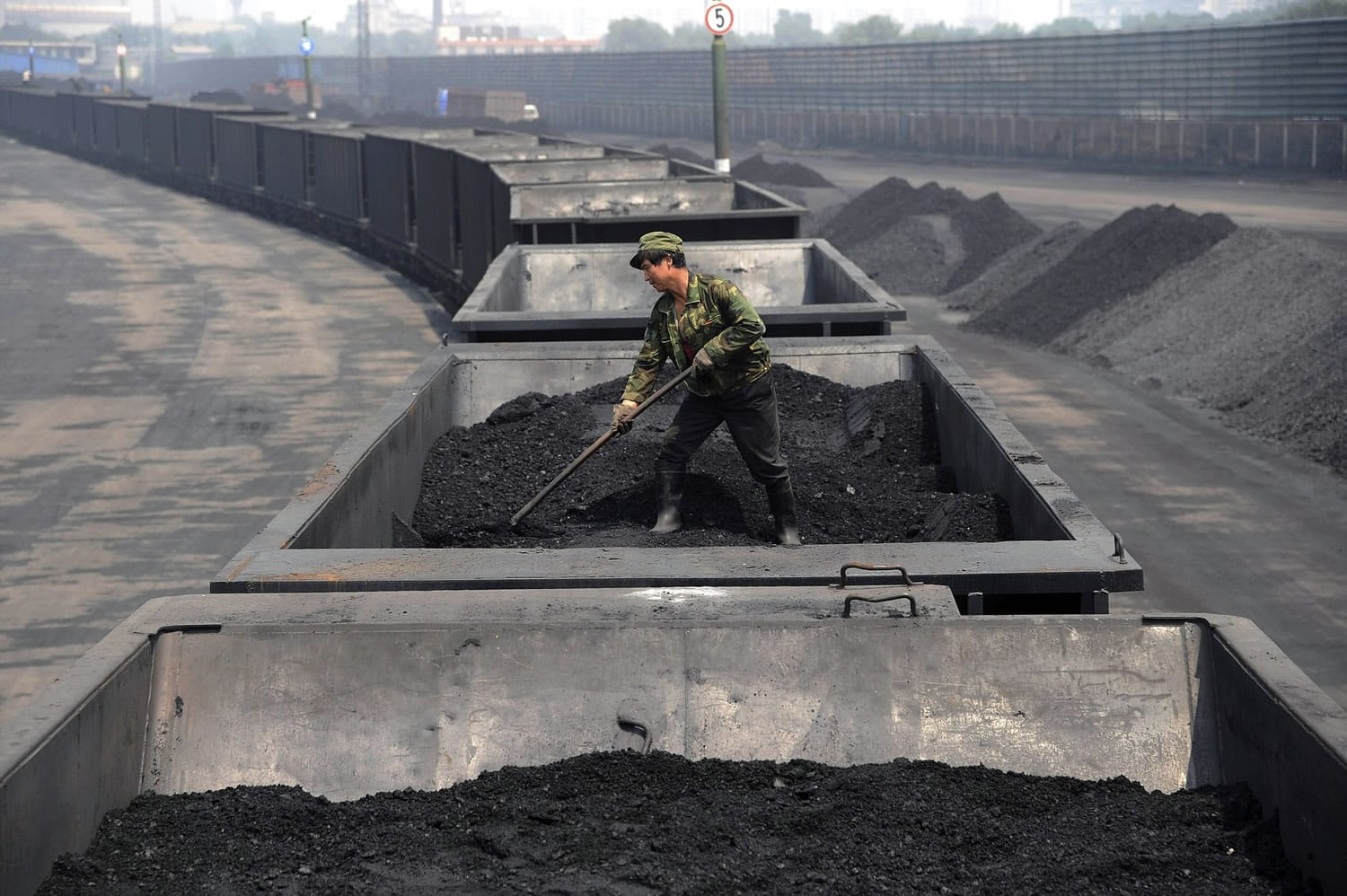 Associated Press files
A worker levels the coal on a freight train in July 2013 in Taiyuan in northern China's Shanxi province. Spurred chiefly by China, the United States and India, the world spewed far more carbon pollution into the air in the past year than ever before, scientists announced Sunday as world leaders gather to discuss how to reduce heat-trapping gases.