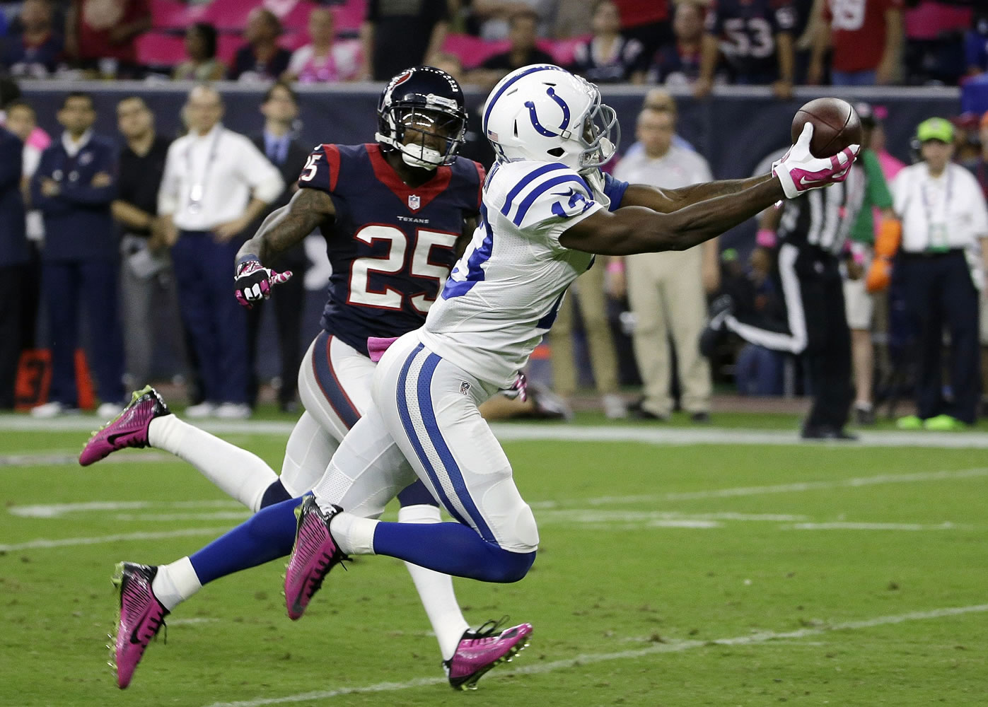 Indianapolis Colts' T.Y. Hilton (13) catches a pass in front of Houston Texans' Kareem Jackson (25) during the first quarter Thursday, Oct. 9, 2014, in Houston. (AP Photo/David J.