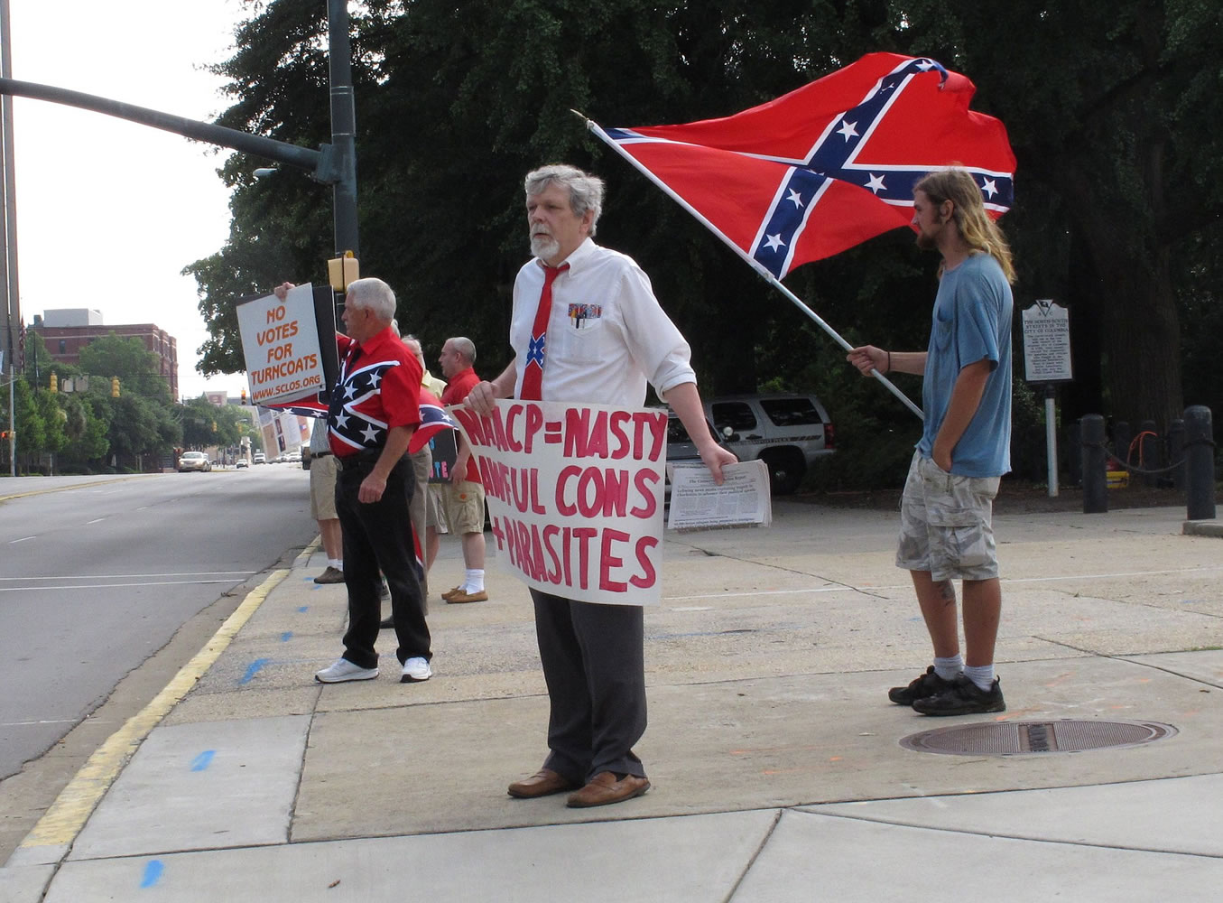 William Cheek, left, Nelson Waller, center, and Jim Collins protest proposals to remove the Confederate flag from the grounds of the South Carolina Statehouse on Monday in Columbia, S.C. The General Assembly returns Monday to discuss Gov.