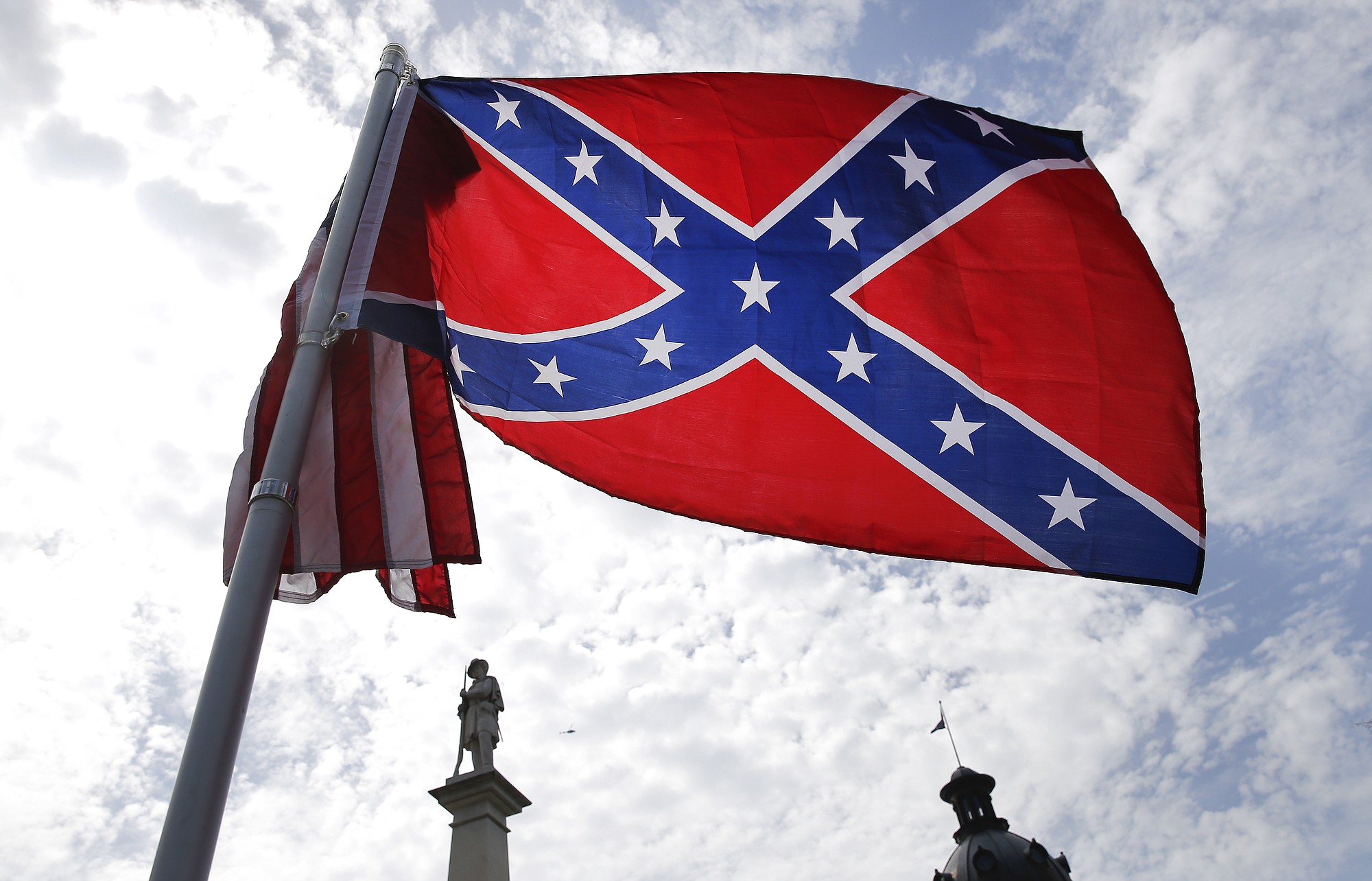 A protester waves a Confederate battle flag in front of the South Carolina statehouse on Thursday in Columbia, S.C.