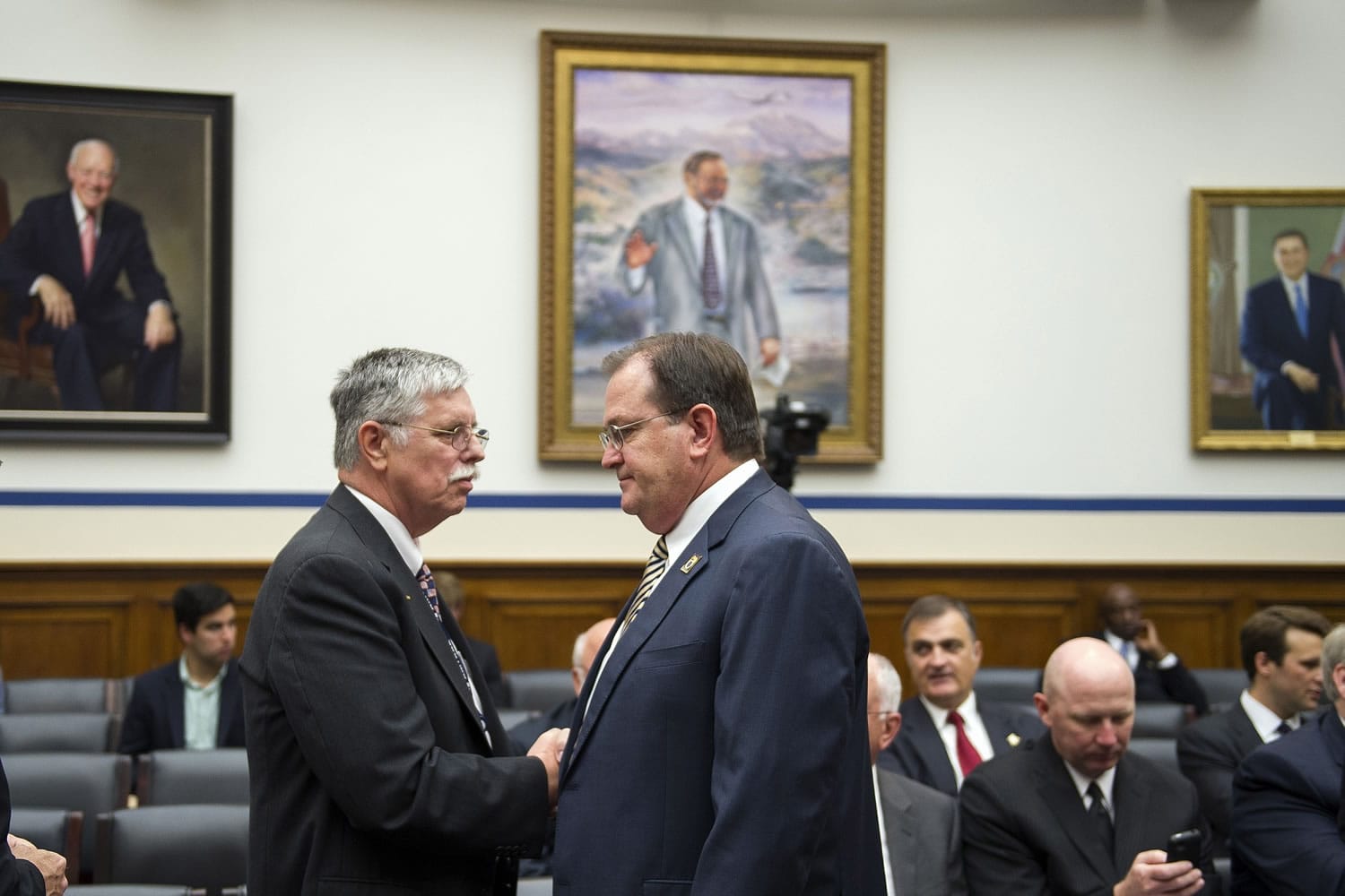 Amtrak President and CEO Joseph Boardman, left, talks with Dennis Pierce, national president, Brotherhood of Locomotive Engineers and Trainmen, on Capitol Hill in Washington, prior to testifying Tuesday before the House Transportation and Infrastructure Committee oversight hearing of the Amtrak train derailment in Philadelphia.