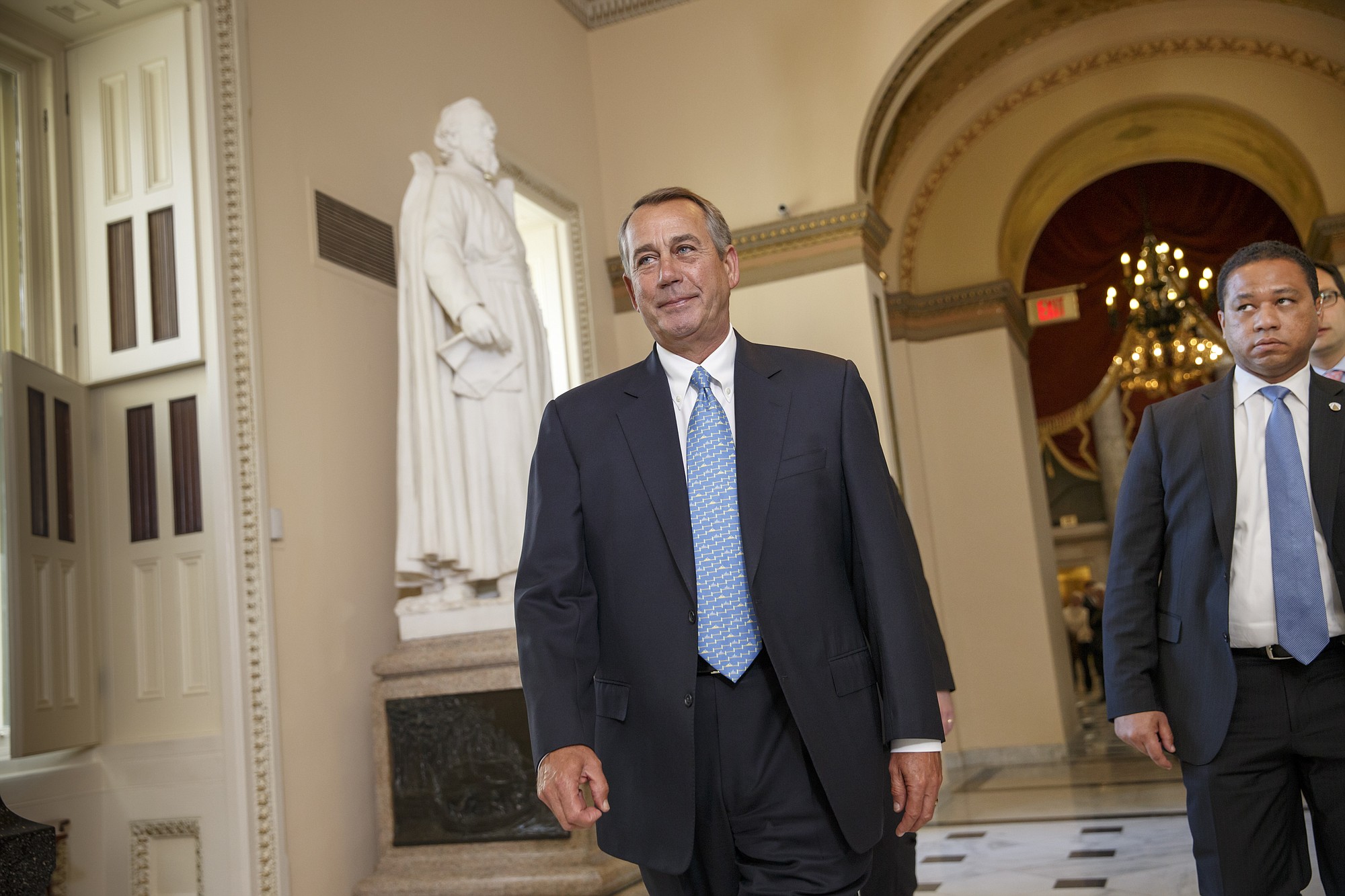 House Speaker John Boehner of Ohio walks to the House chamber on Capitol Hill on Friday in Washington for a procedural vote.