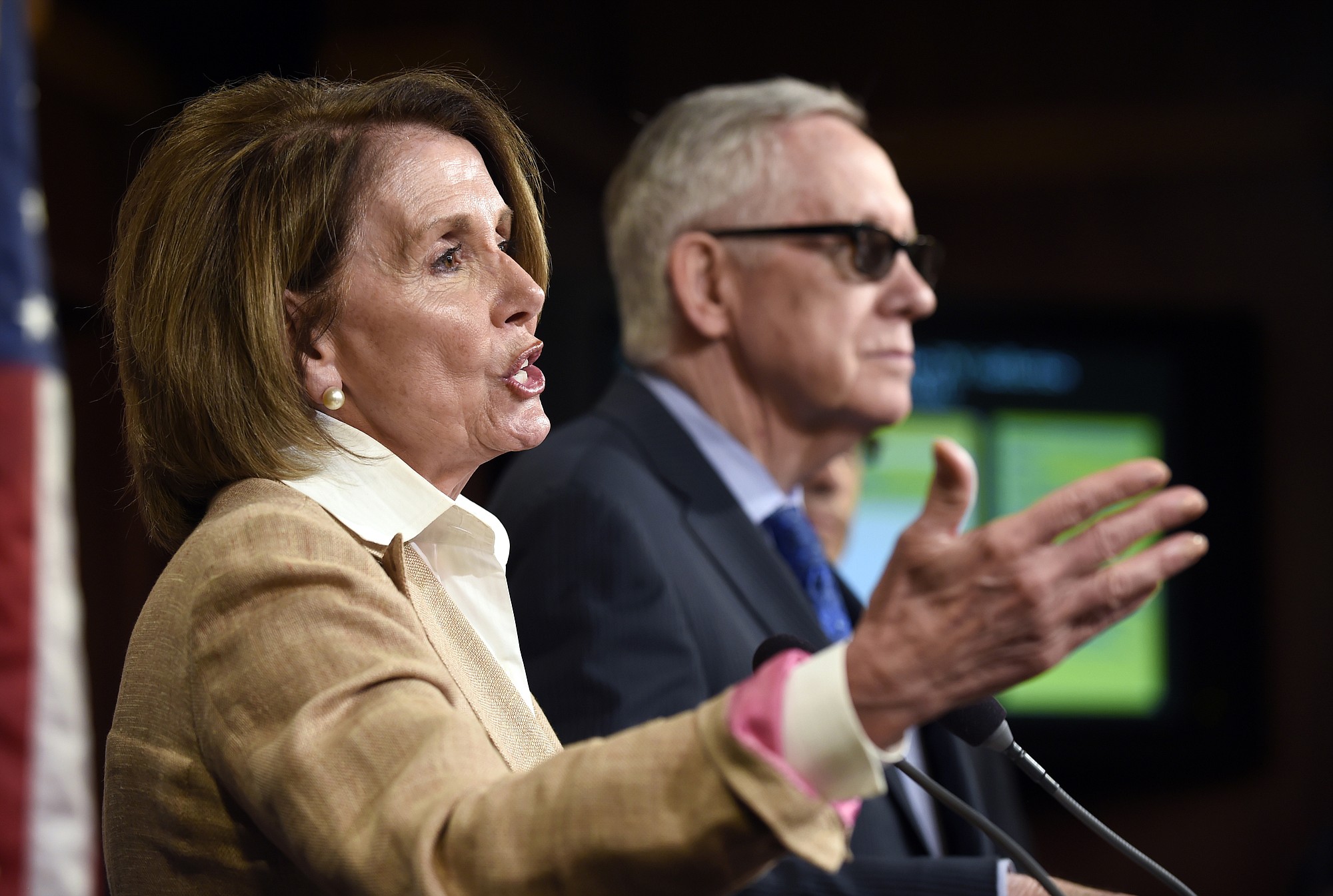 House Minority Leader Nancy Pelosi of Calif., left, accompanied by Senate Minority Leader Harry Reid of Nev. speaks during a news conference June 25 on Capitol Hill in Washington.
