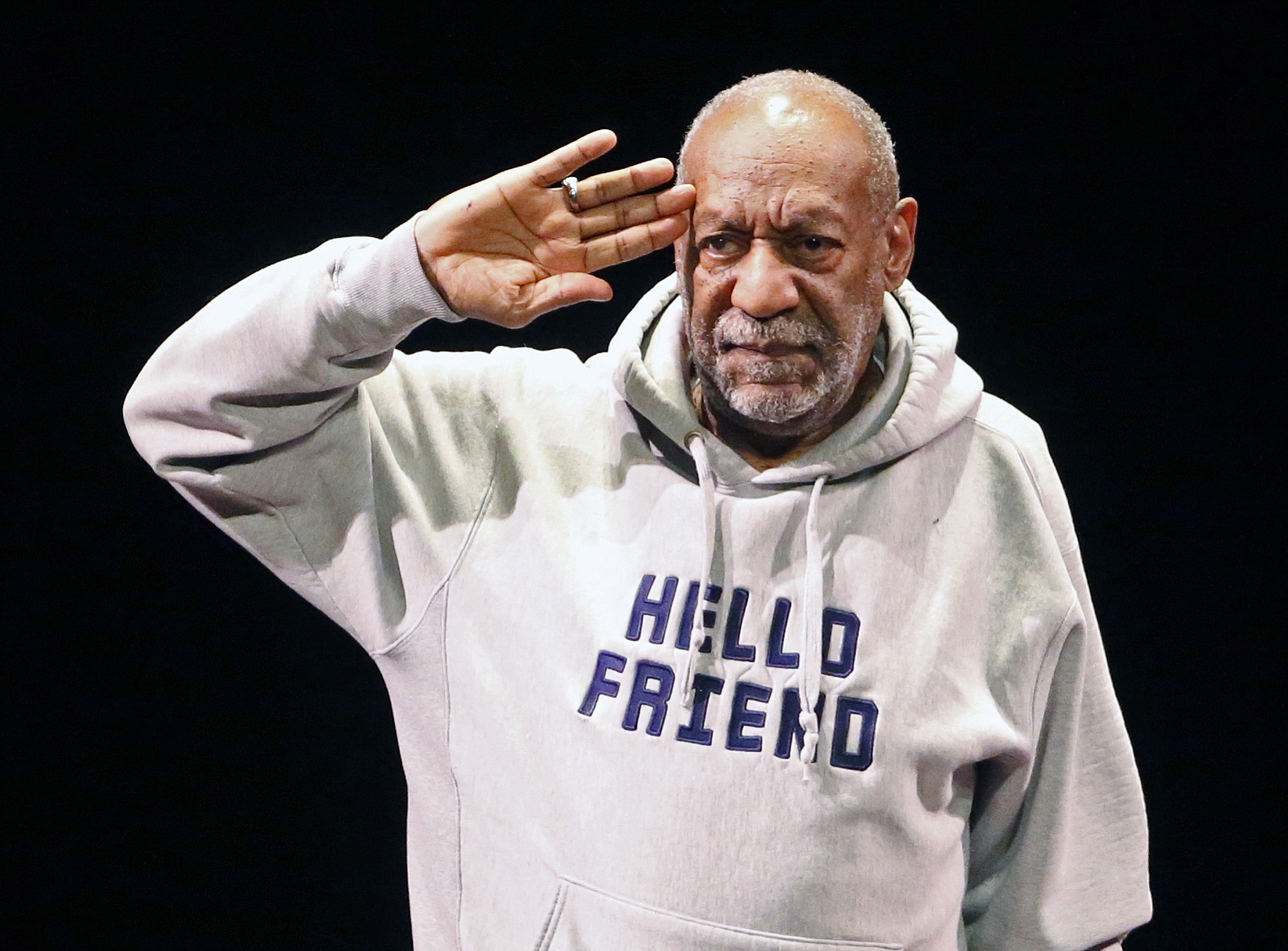 Comedian Bill Cosby salutes the crowd as he begins a performance at the Buell Theater in Denver.