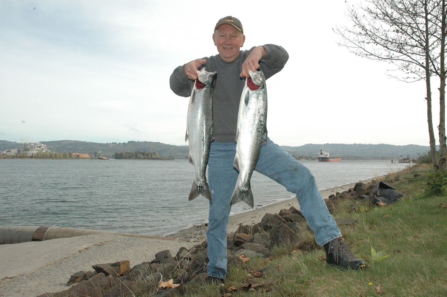 Angler Dick Borneman of Vancouver with a pair of coho caught in mid-October in the Columbia River at the mouth of the Cowlitz River.