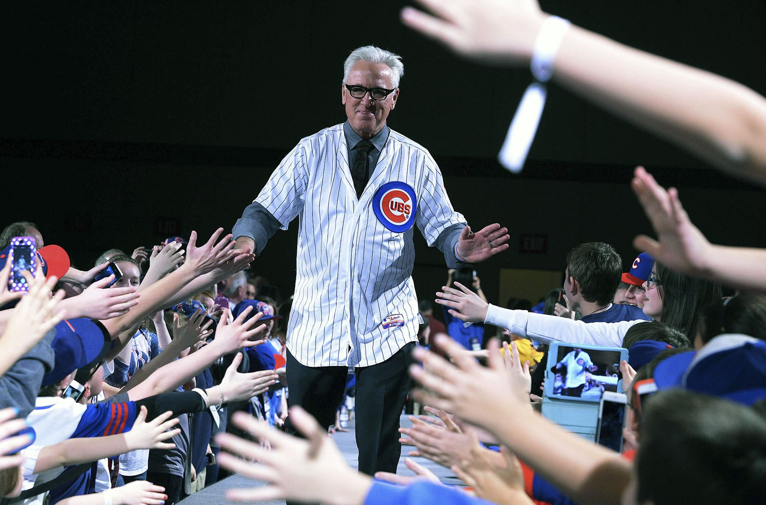 New Chicago Cubs manager Joe Maddon greets the fans during opening night of the annual Cubs Convention, Friday, Jan. 16, 2015 in Chicago.