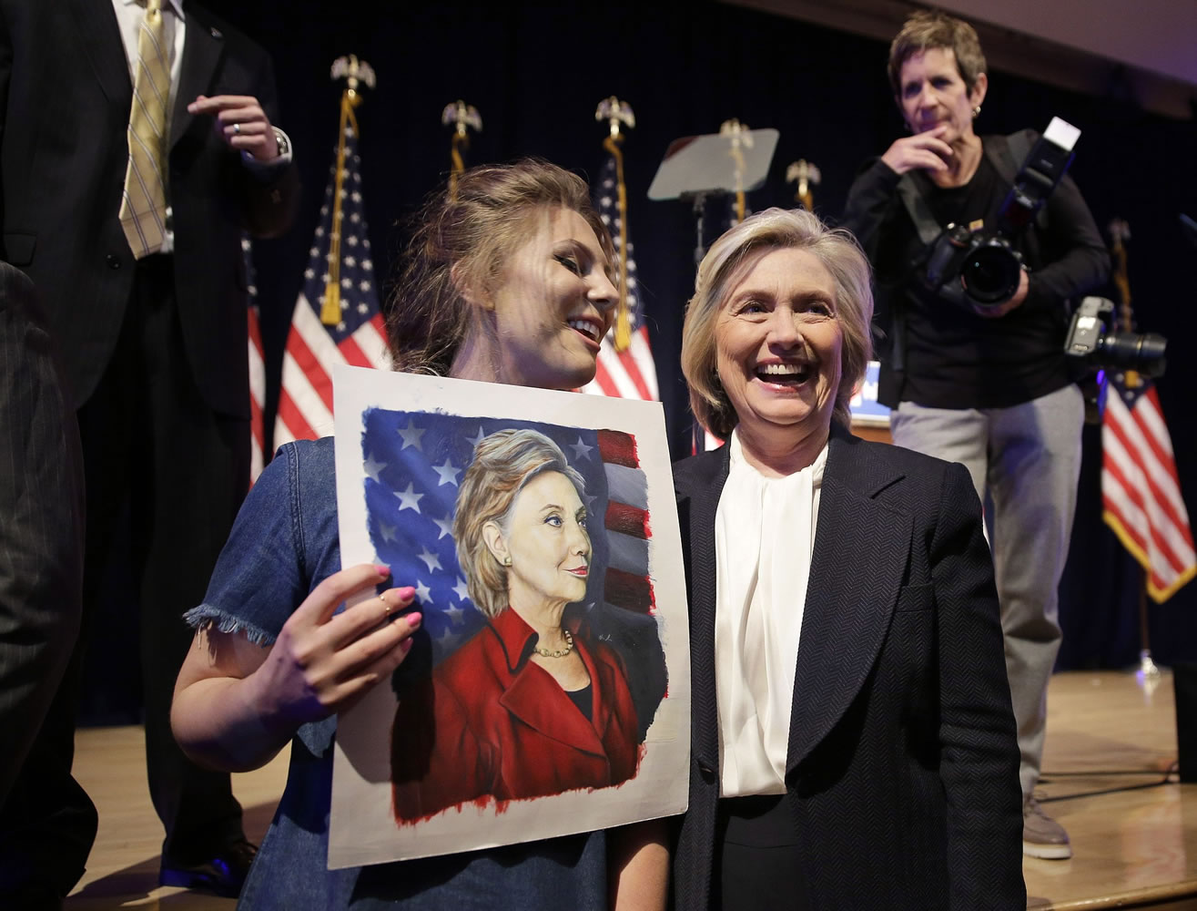 Chelsea Galinos, 21, left, who painted a picture of the democratic presidential candidate Hillary Rodham Clinton, greets Clinton after a campaign event in New York on Monday.