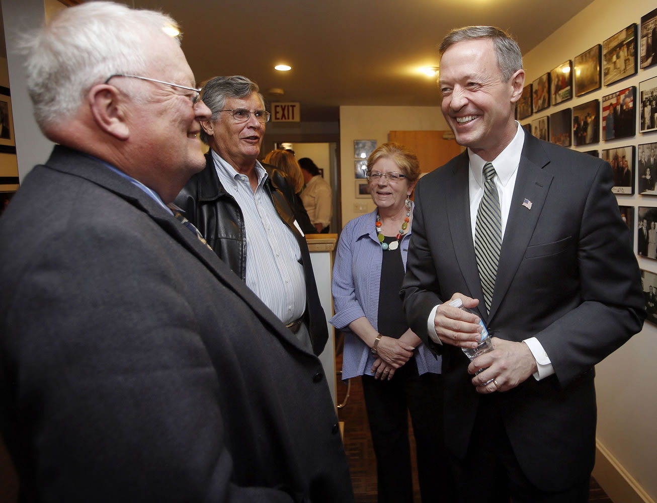 Former Maryland Gov. Martin O'Malley, right, talks with New Hampshire State Rep. Bob Backus, left, and former State Sen.