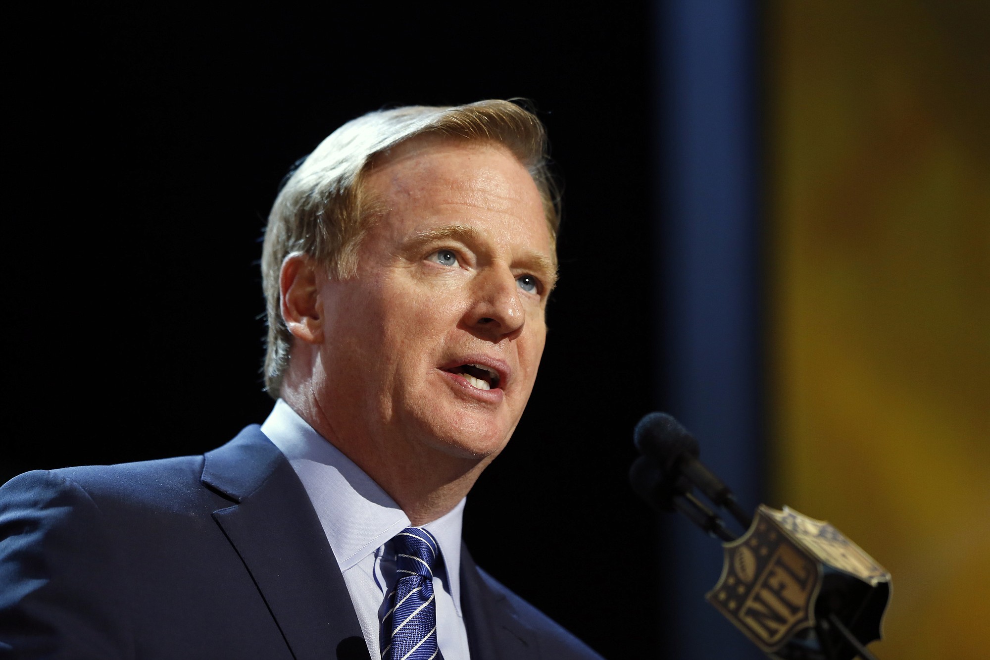 FILE - In this Thursday, April 30, 2015 file photo, NFL commissioner Roger Goodell speaks during the first round of the 2015 NFL Football Draft in Chicago.