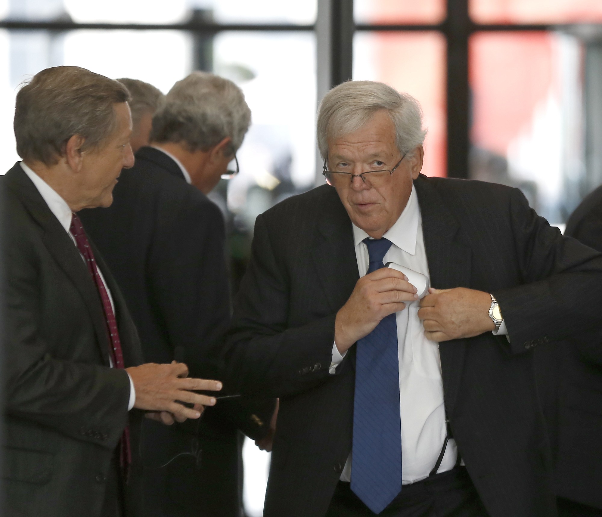 Former House Speaker Dennis Hastert, right, arrives at the federal courthouse Tuesday  in Chicago for his arraignment on federal charges that he broke federal banking laws and lied about the money when questioned by the FBI.