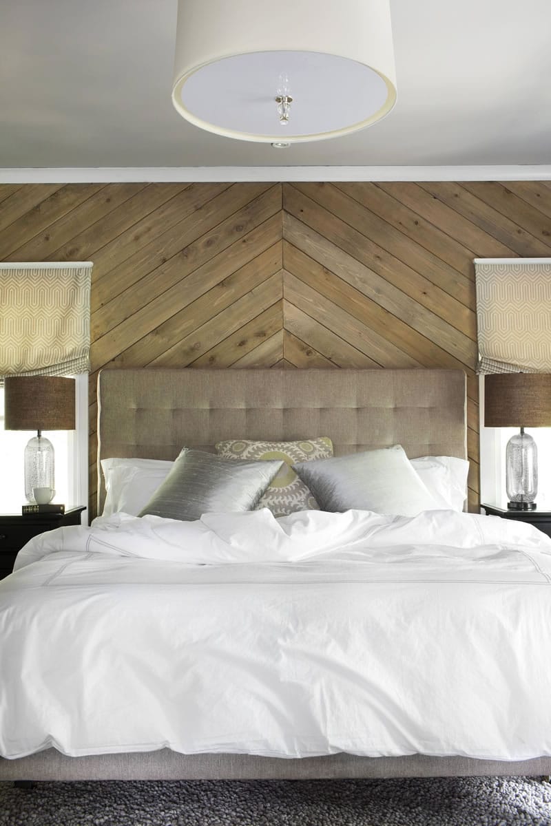 To add texture and pattern to this master bedroom, designers Brian Patrick Flynn and Dan Faires outfitted one wall with cedar planks installed in a geometric pattern. Flynn and Faires suggest using softwoods for both interior and exterior applications, because they are more readily available and often more affordable than exotic woods.