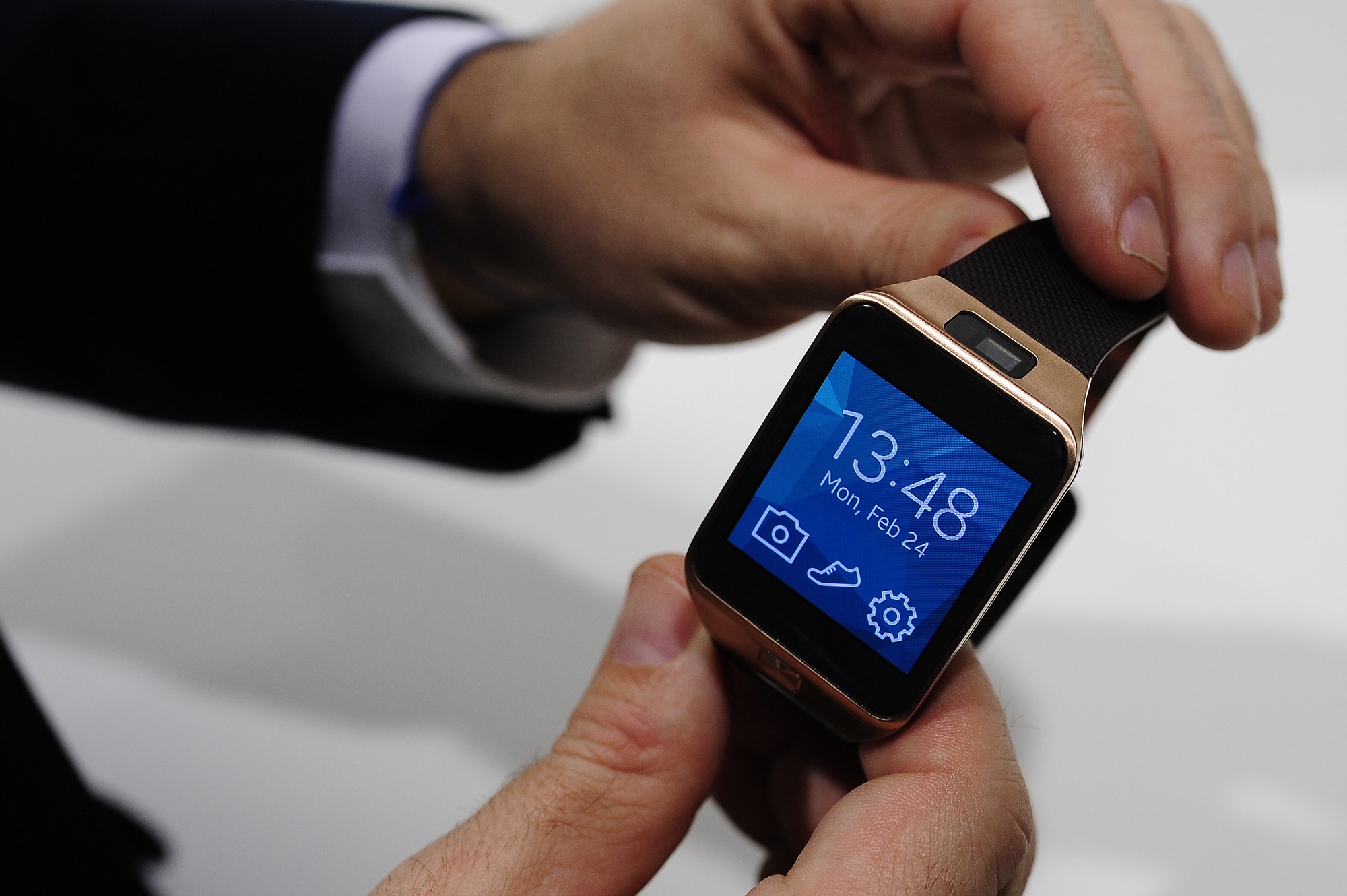 The Samsung Gear 2 smartwatch is displayed at the Mobile World Congress in Spain. The Gear 2 line doesn't use Android Wear, but a fledging system called Tizen. Samsung says that helps extend battery life to two or three days, instead of the single day on the original, Android-based Galaxy Gear.