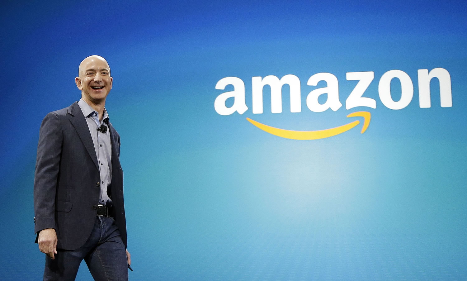Amazon CEO Jeff Bezos walks on stage June 16 for the launch of the new Amazon Fire Phone, in Seattle.