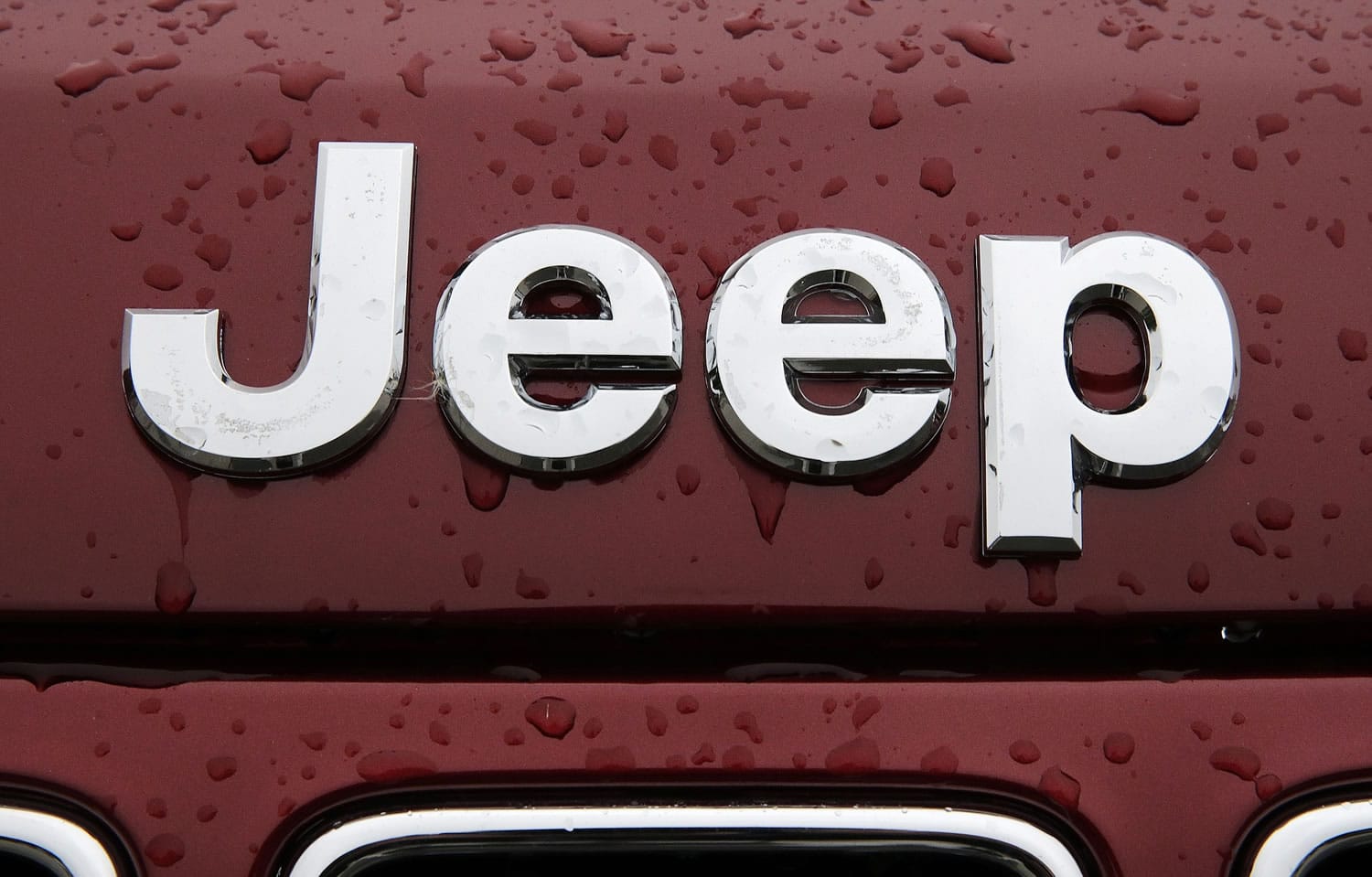Rain drops coat the hood of a Jeep Grand Cherokee at Bill DeLuca's dealerships in Haverhill, Mass.