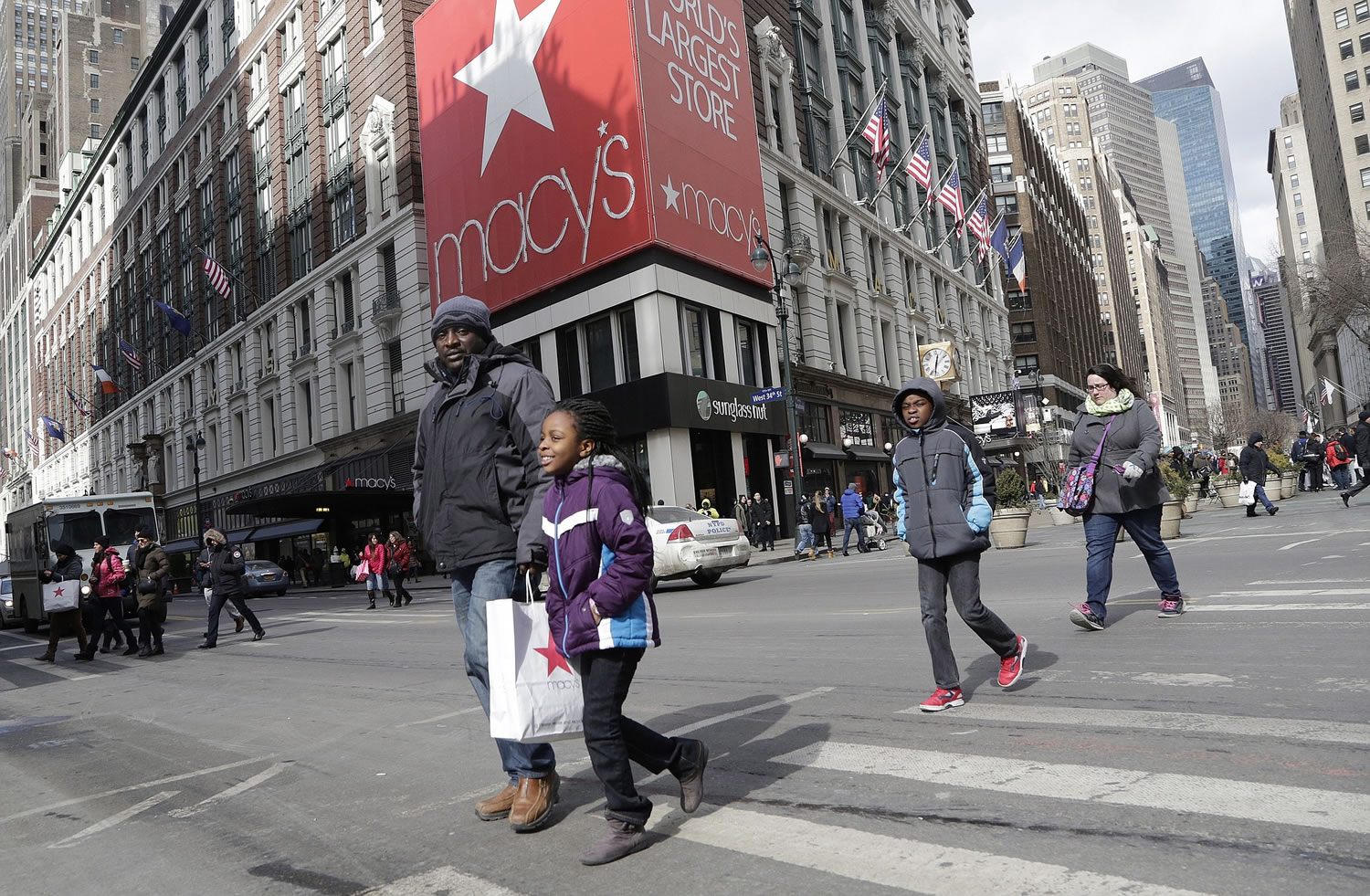 Macy's shoppers leave the retailer's flagship store Feb.
