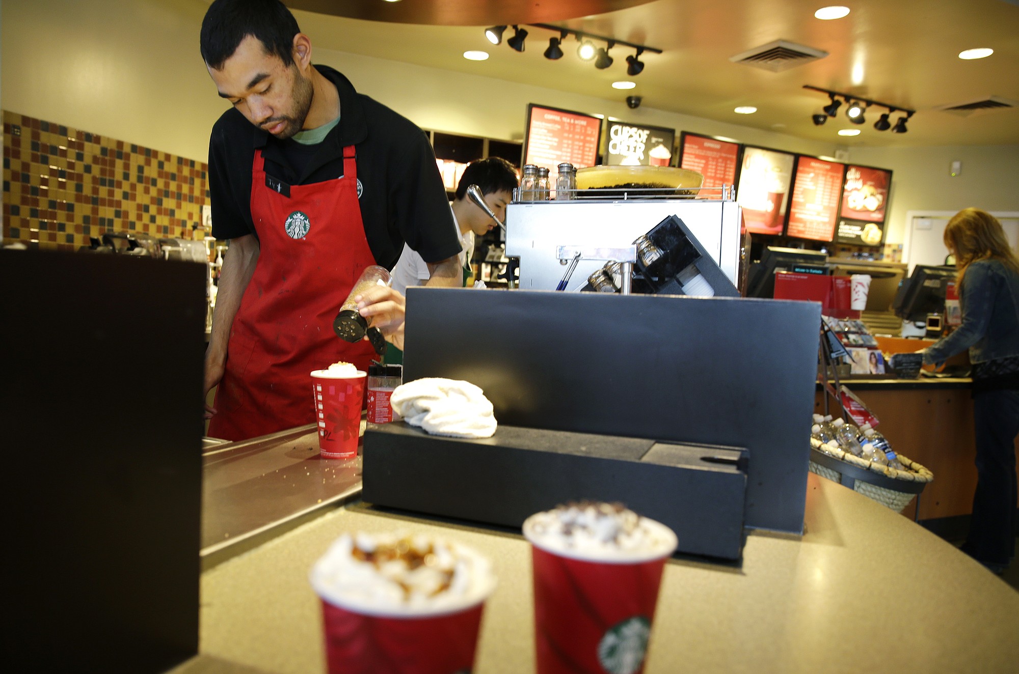 Barista Jay Rapp prepares a Chestnut Praline Latte at a Starbucks store in Seattle in November.