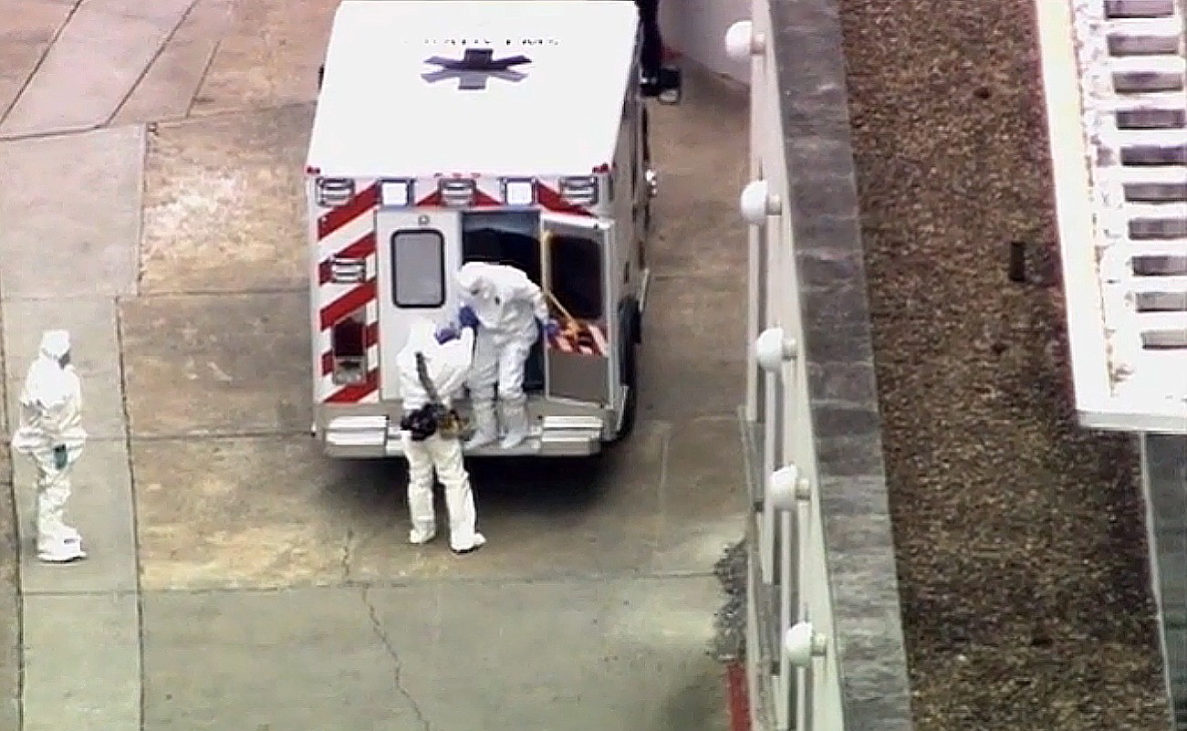 WSB-TV Atlanta/Associated Press
Ebola victim Dr. Kent Brantly, right, leaves an ambulance Saturday at Emory University Hospital in Atlanta.