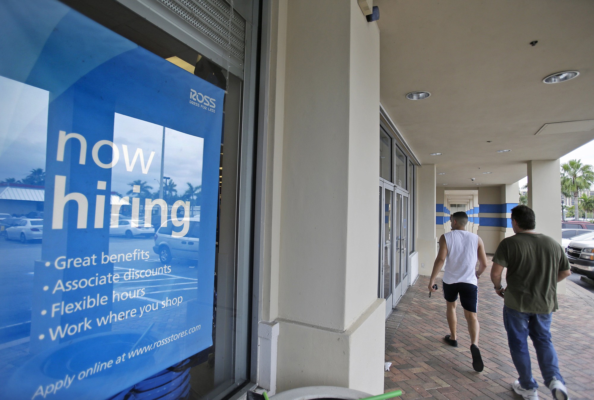 Wilfredo Lee/Associated Press files
Shoppers pass a &quot;Now hiring&quot; sign in May at a Ross store in Florida. As the economic recovery that began in mid-2009 enters its sixth year, many Americans don't feel better off.