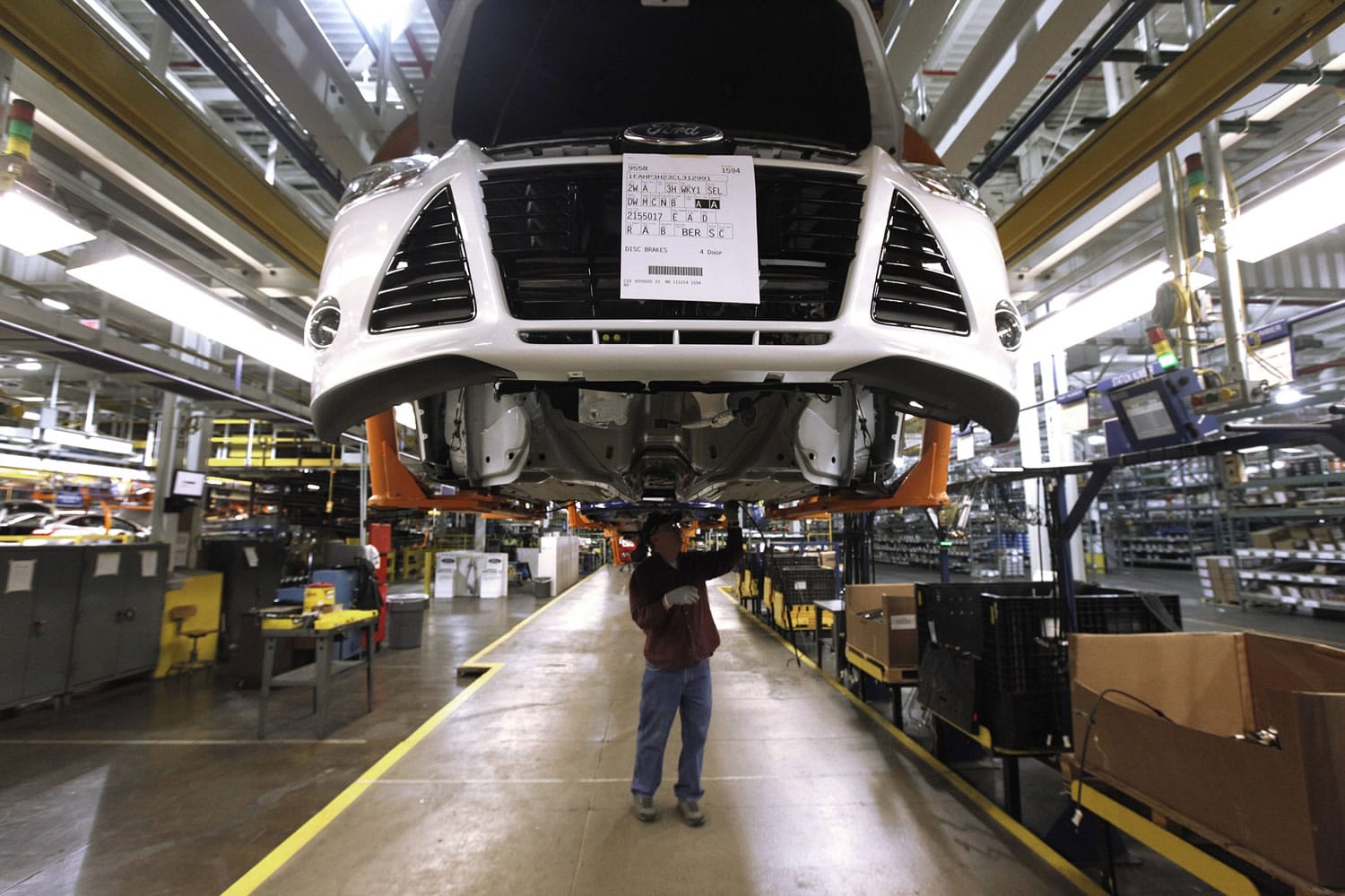 A line worker assembles a Ford Focus at the Ford Michigan Assembly plant in Wayne, Mich. The jobs report on Friday signaled that raises have finally begun to flow through an economy in which, once you factor in inflation, most people earn less than when the Great Recession struck in 2007.