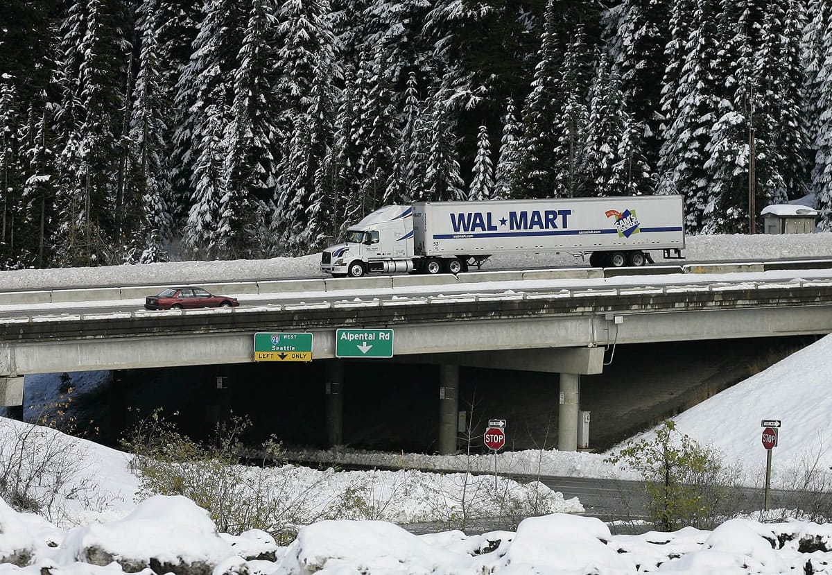 A Wal-Mart truck drives westbound through the snow on I-90 over Snoqualmie Pass near Hyak.