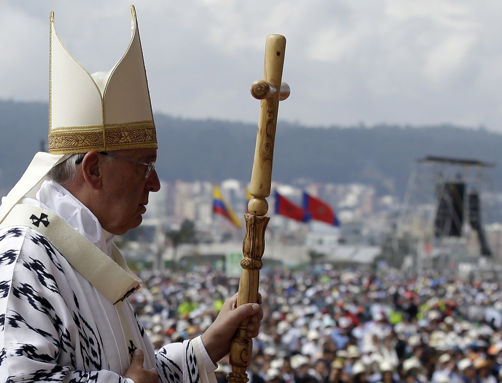 Pope Francis walks with his pastoral staff to celebrate Mass at Bicentennial Park in Quito, Ecuador, on Tuesday.