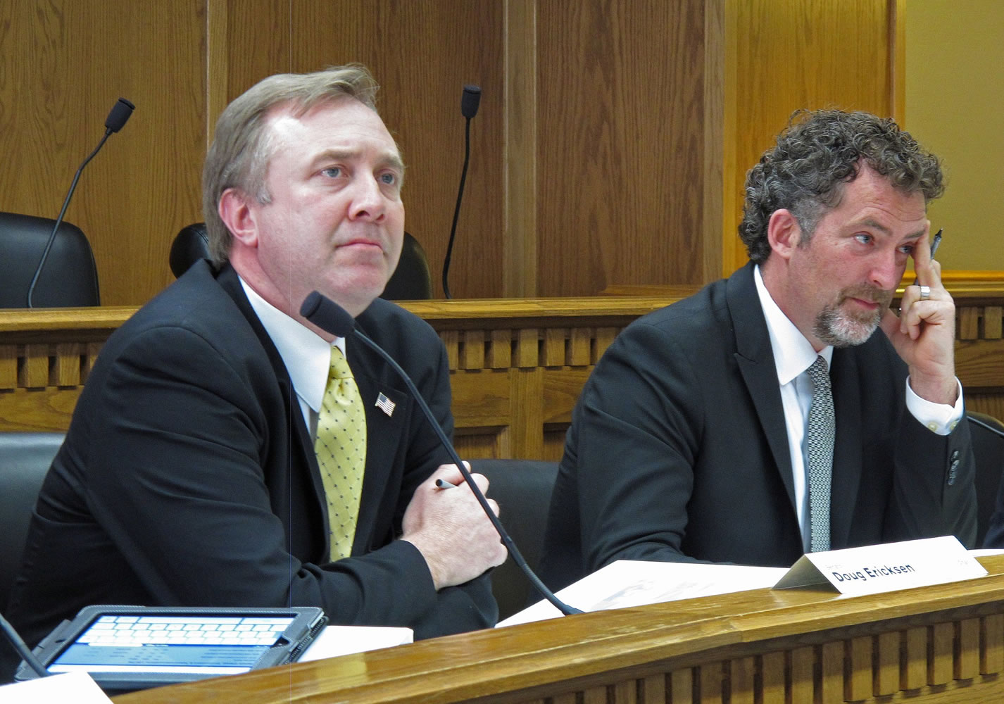Republican state Sen. Doug Ericksen, left, and Democratic state Sen. Kevin Ranker listen to testimony March 26, 2013 from a climate change skeptic at a hearing in Olympia. Flush with cash from California billionaire Tom Steyer, a Washington state environmental group is backing candidates this November who they think can help Democratic Gov.