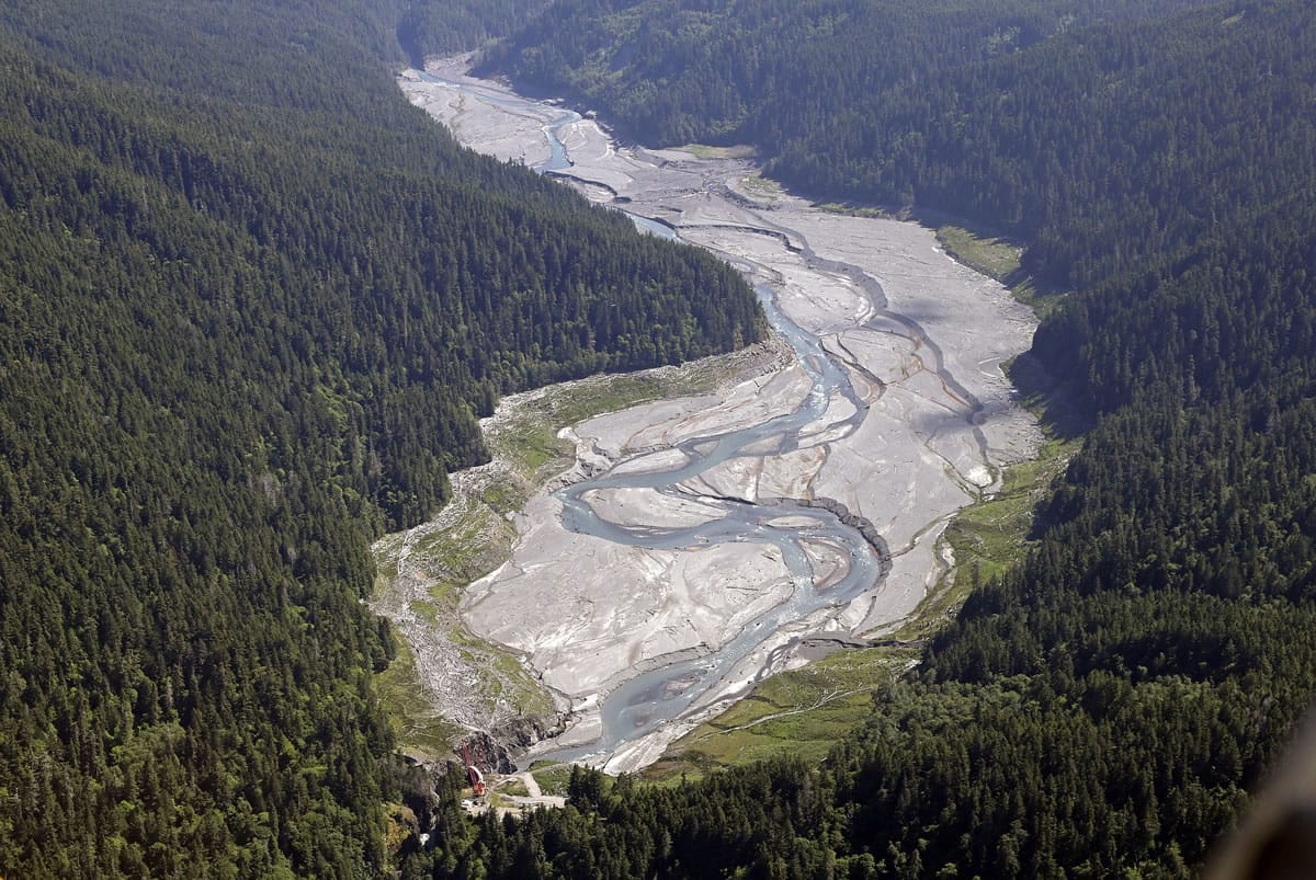 The Elwha River flows freely June 3 through what was Lake Mills and past the old Glines Canyon Dam, bottom, in the Olympic National Park near Port Angeles.