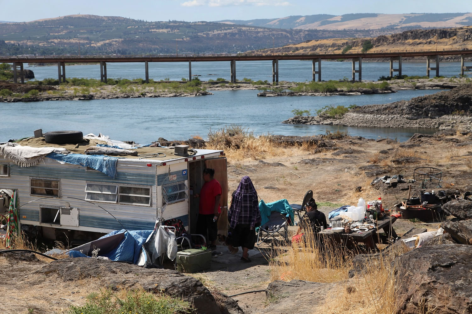 The home of Ranetta Spino and her family sits at the river's edge at Lone Pine, a Native American fishing site on the Columbia River near The Dalles, Ore.