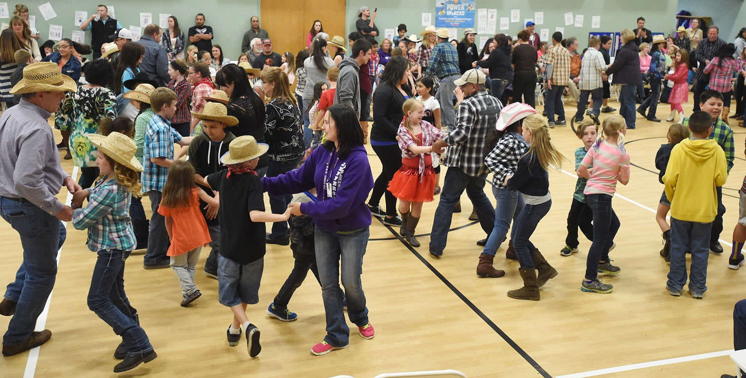 Mark Ylen/Albany Democrat-Herald
People participate in a community square dance May 12 at Jefferson Elementary School in Jefferson, Ore. Oregon designated the square dance as its official state dance in 1977.