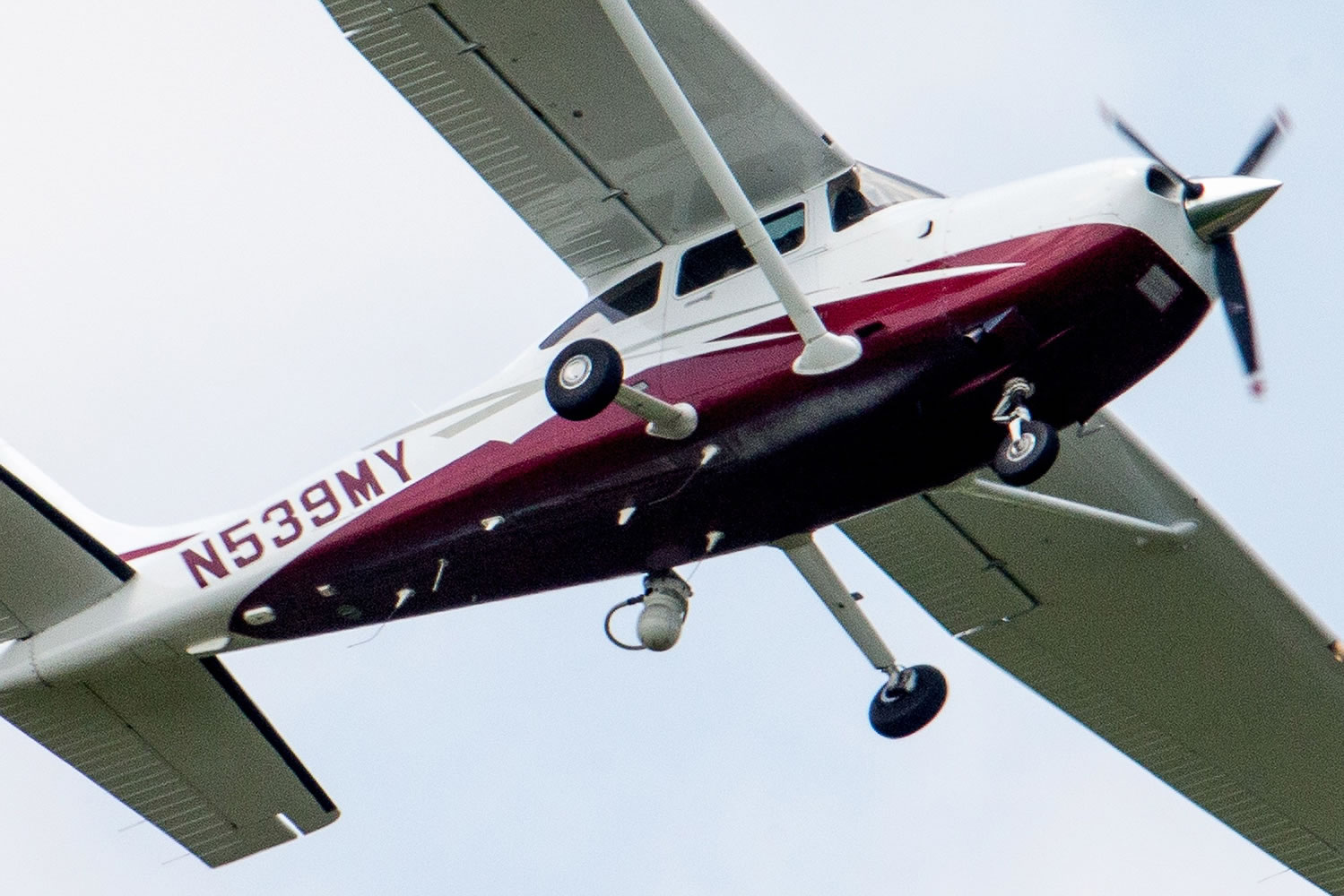 In this photo taken, a small plane flies May 26 near Manassas Regional Airport in Manassas, Va. The plane is among a fleet of surveillance aircraft used by the FBI, primarily to target suspects under federal investigation.