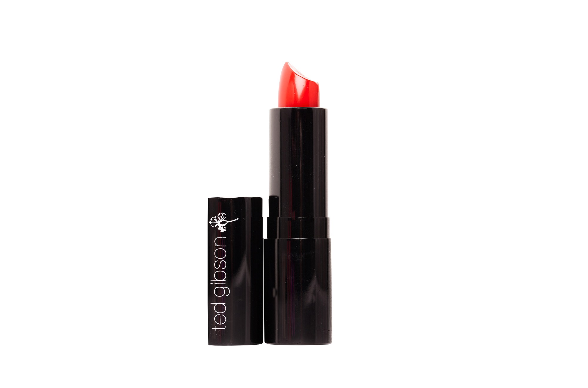 This product image provided by Ted Gibson shows a red lipstick in a shade called Charice. Shades of red no longer have to evoke sexpot, and they don't have to be drying to stay in place. They can be had in balms, glosses, creamy mattes or a combination of care and color.