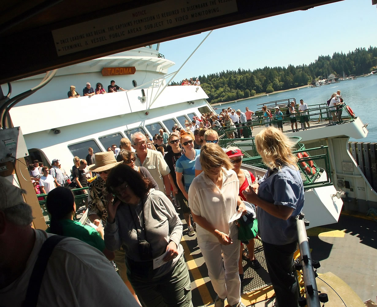 Passengers disembark the Tacoma on Tuesday.