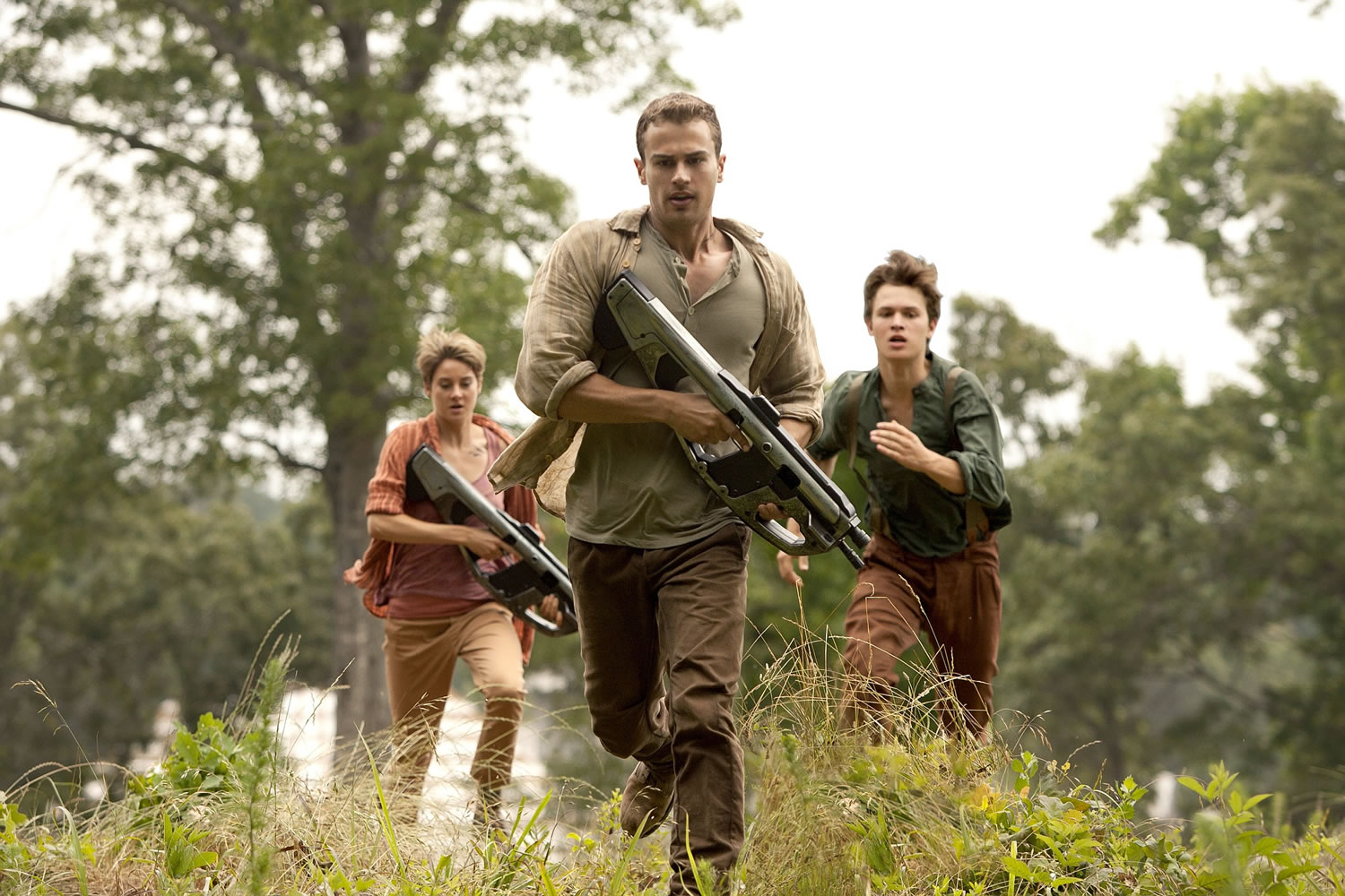 Theo James, center, Shailene Woodley, left, and Ansel Elgort appear in a scene from &quot;The Divergent Series: Insurgent.&quot;
Andrew Cooper/Lionsgate