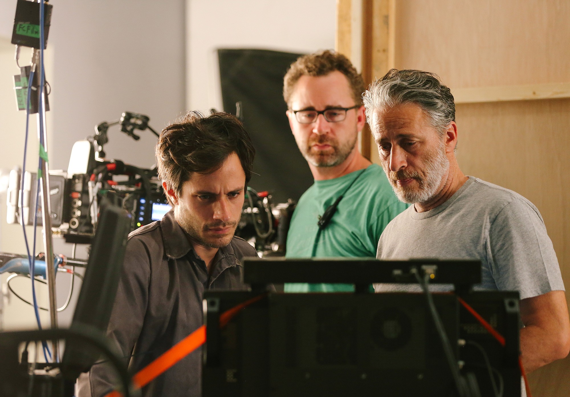 Actor Gael Garcia Bernal, from left, first assistant cameraman Michael Burke and Jon Stewart review a shot on the set of &quot;Rosewater.&quot; Stewart took a three-month leave from hosting &quot;The Daily Show&quot; to make &quot;Rosewater.&quot;