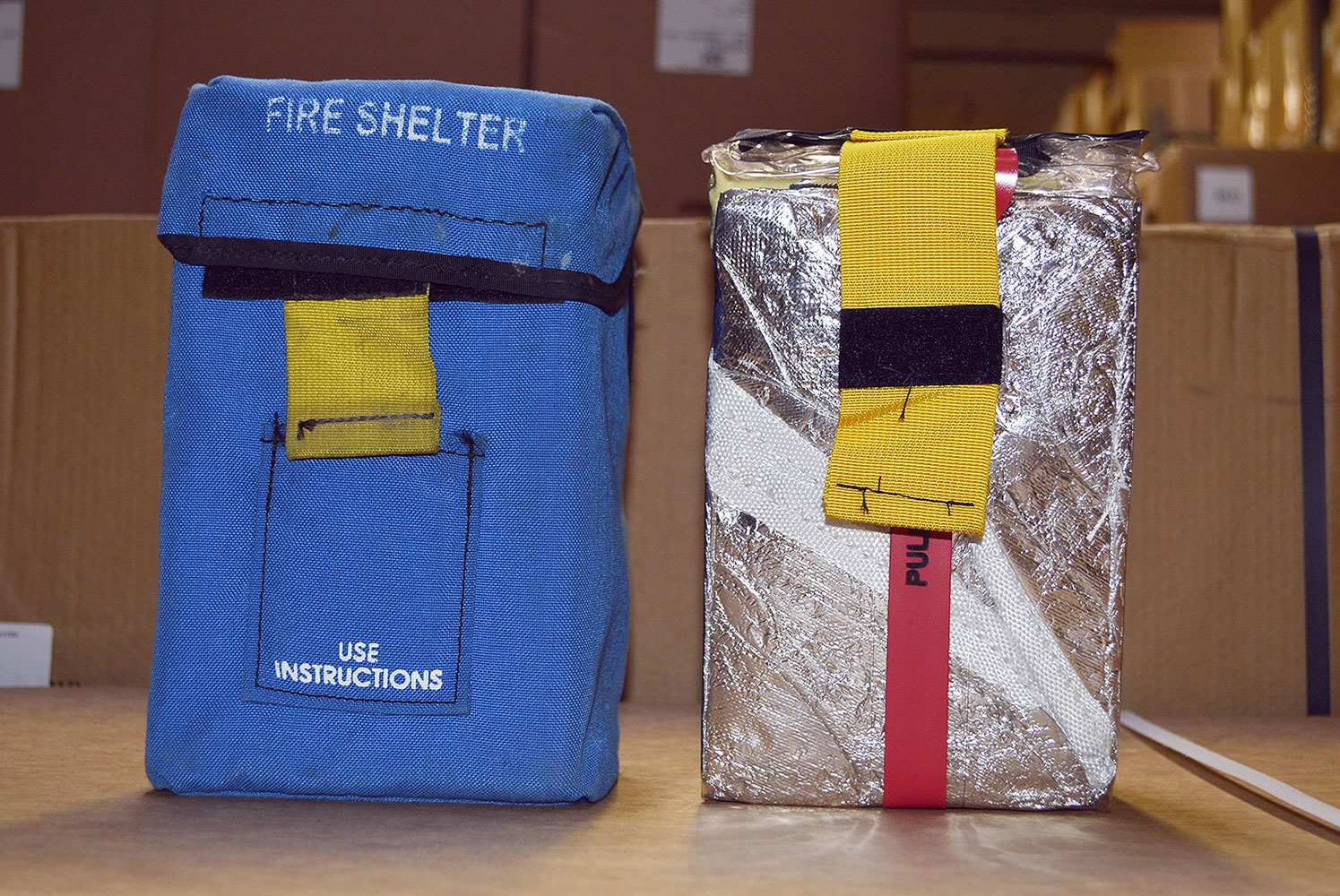 The fire shelter currently in use, right, and its protective pouch, at the NIFC in Boise, Idaho. The U.S.