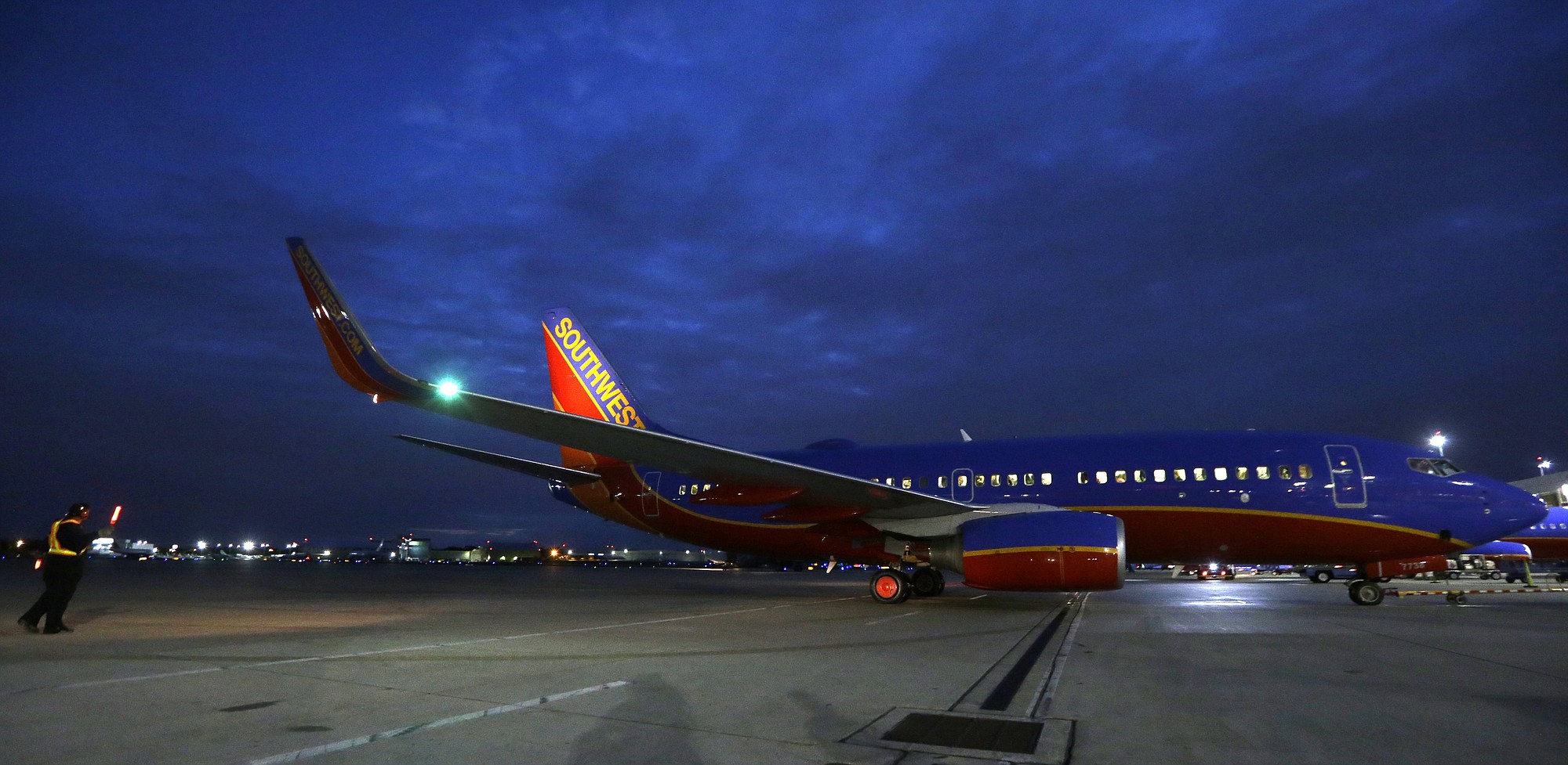 A Southwest Airlines originator flight pulls from the gate for departure from Love Field in Dallas.
