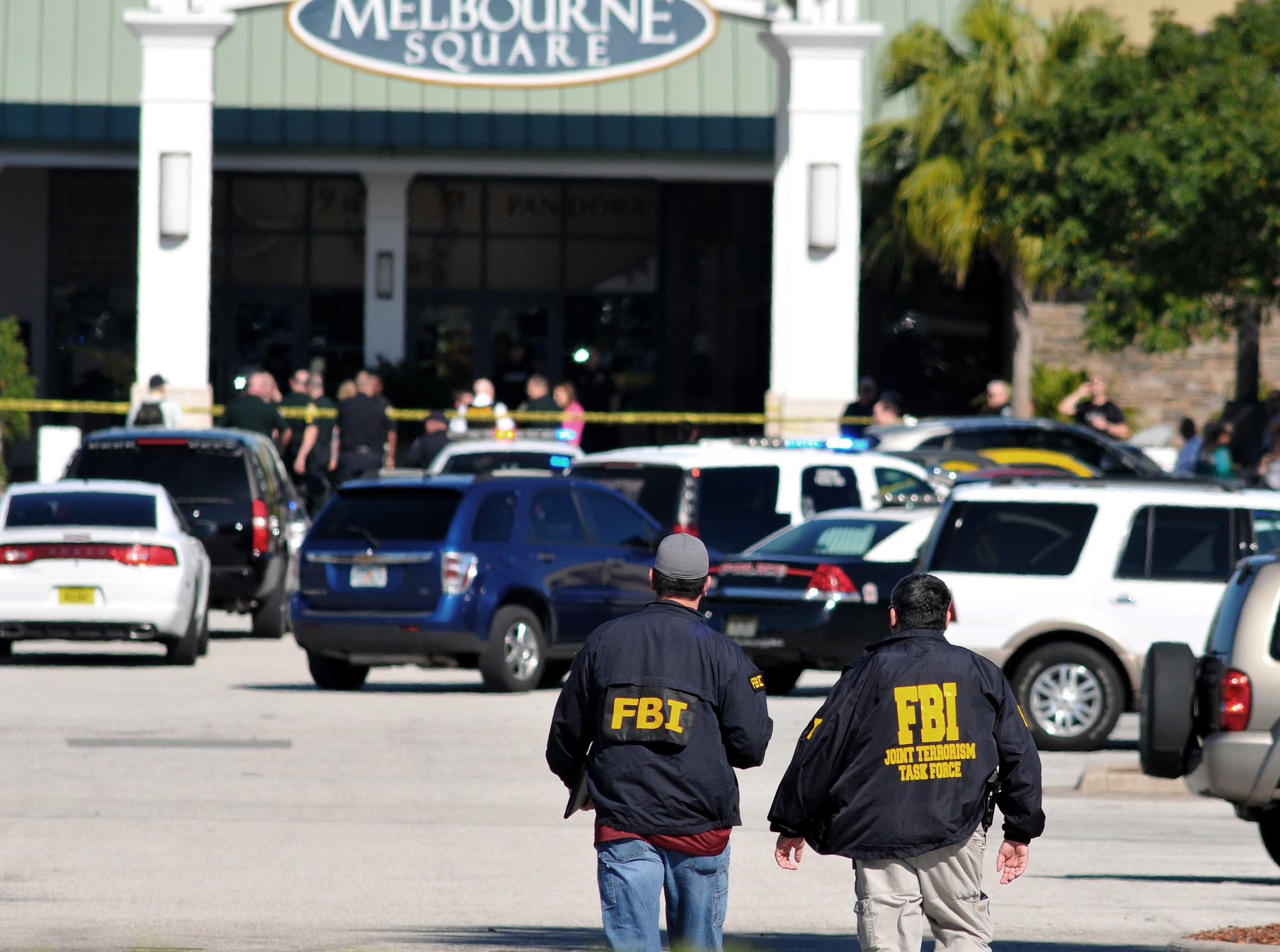 Law enforcement including the FBI respond to the scene of a shooting at the Melbourne Square Mall on Saturday, in Melbourne, Fla. Melbourne Police have confirmed that the shooting Saturday morning at the mall has left two people dead and one injured from a gunshot wound. Police say the injured victim is hospitalized in stable condition and cooperating with investigators. After responding to reports around 9:30 a.m.