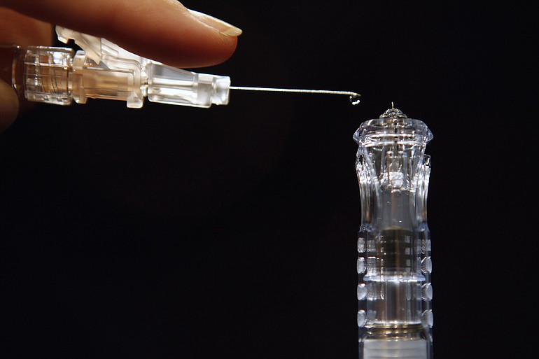 Flu shots have long been injected deep into muscle, requiring a needle an inch long or longer, such as the needle seen at left. However, a new version named Sanofi Pasteur's Fluzone Intradermal, hitting the market this fall, at right, is less than a tenth of an inch long.